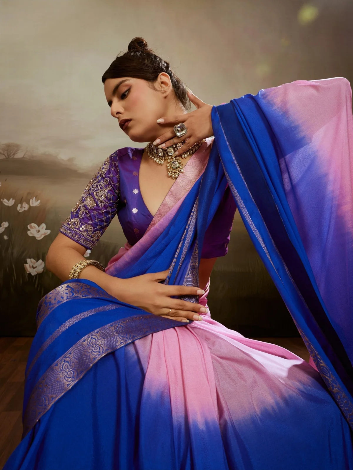 Tarani Aashita chiffon saree pallu view showcasing blue gradient drape and woven zari detailing
