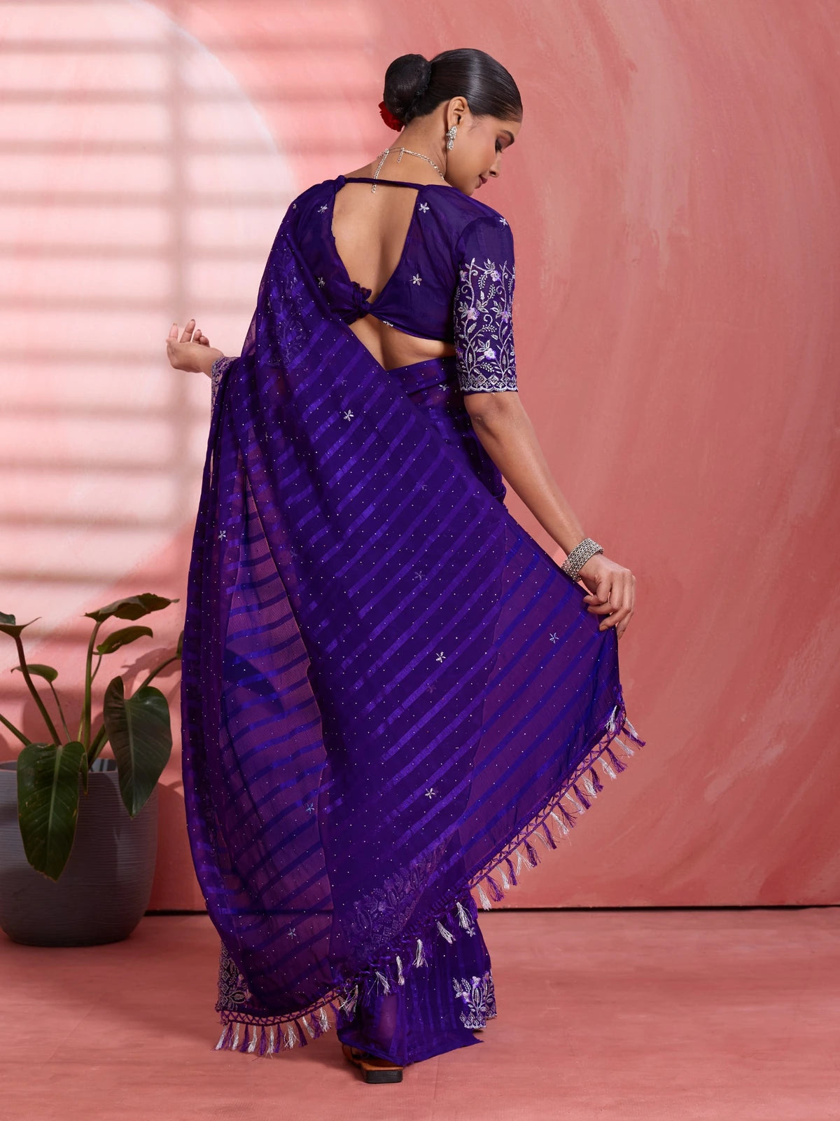 Tarani purple chiffon saree back view with stylish blouse design and pallu