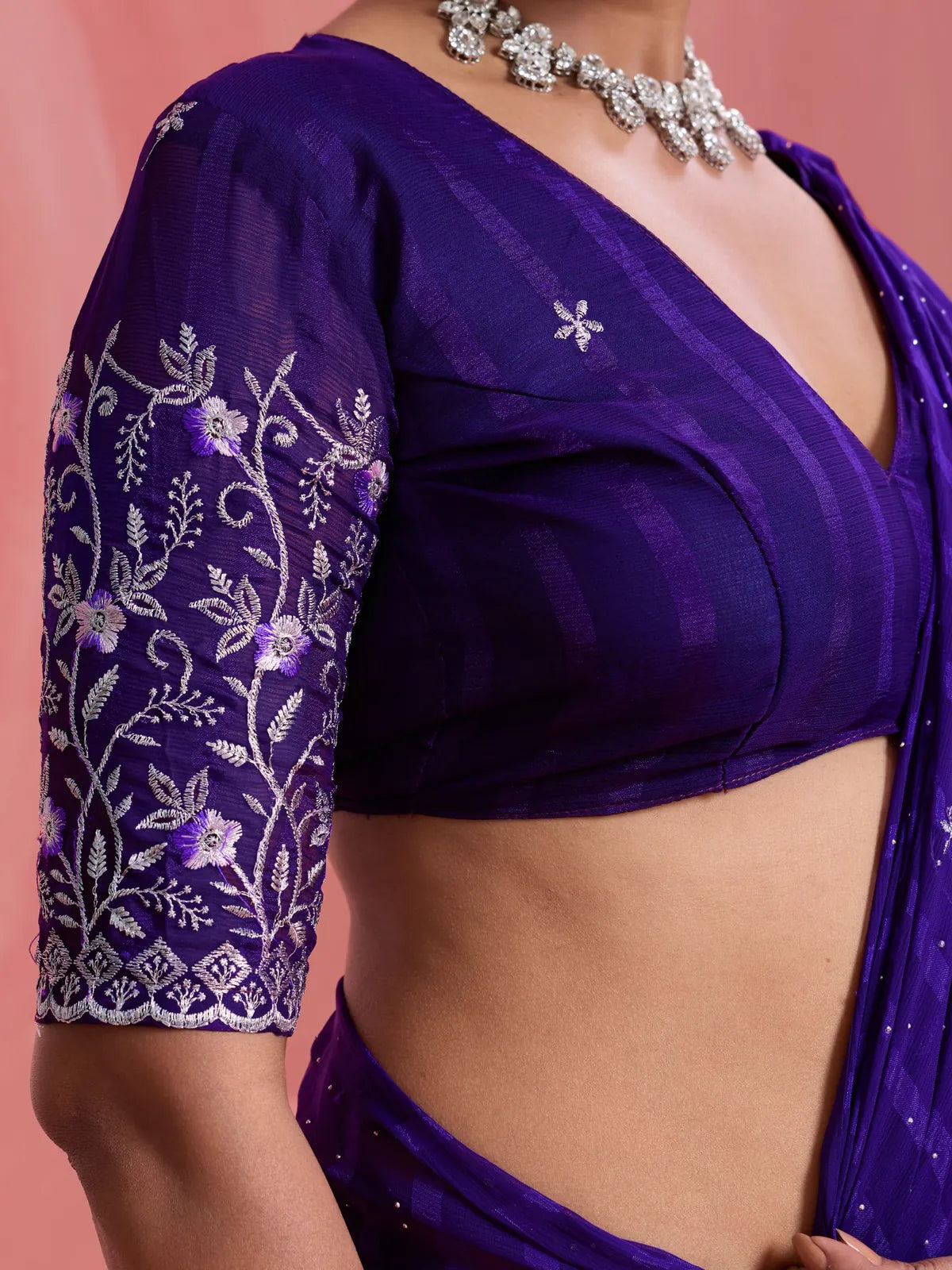 Tarani blouse view with embroidered sleeves on purple chiffon saree by Tarani
