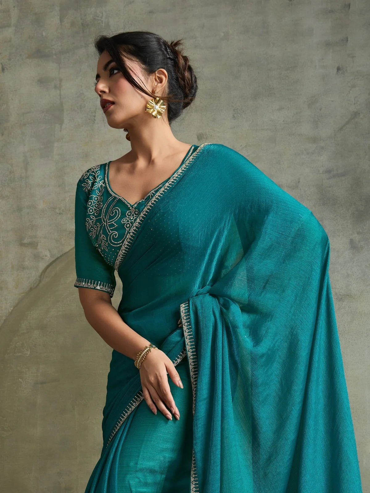 Tarani teal fendy chiffon saree upper body view with designer zarkan blouse and elegant border