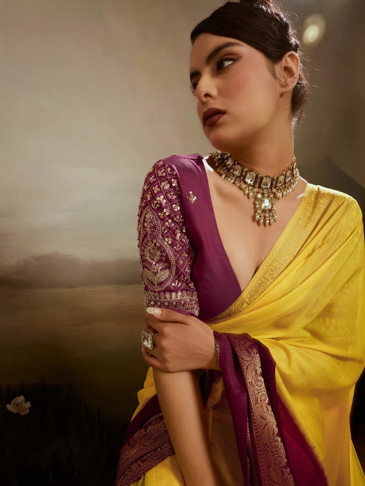 Tarani designer blouse closeup with yellow chiffon saree and zari border