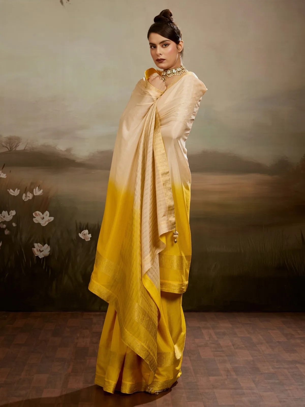 Tarani yellow chiffon saree front view with zari woven border and pallu