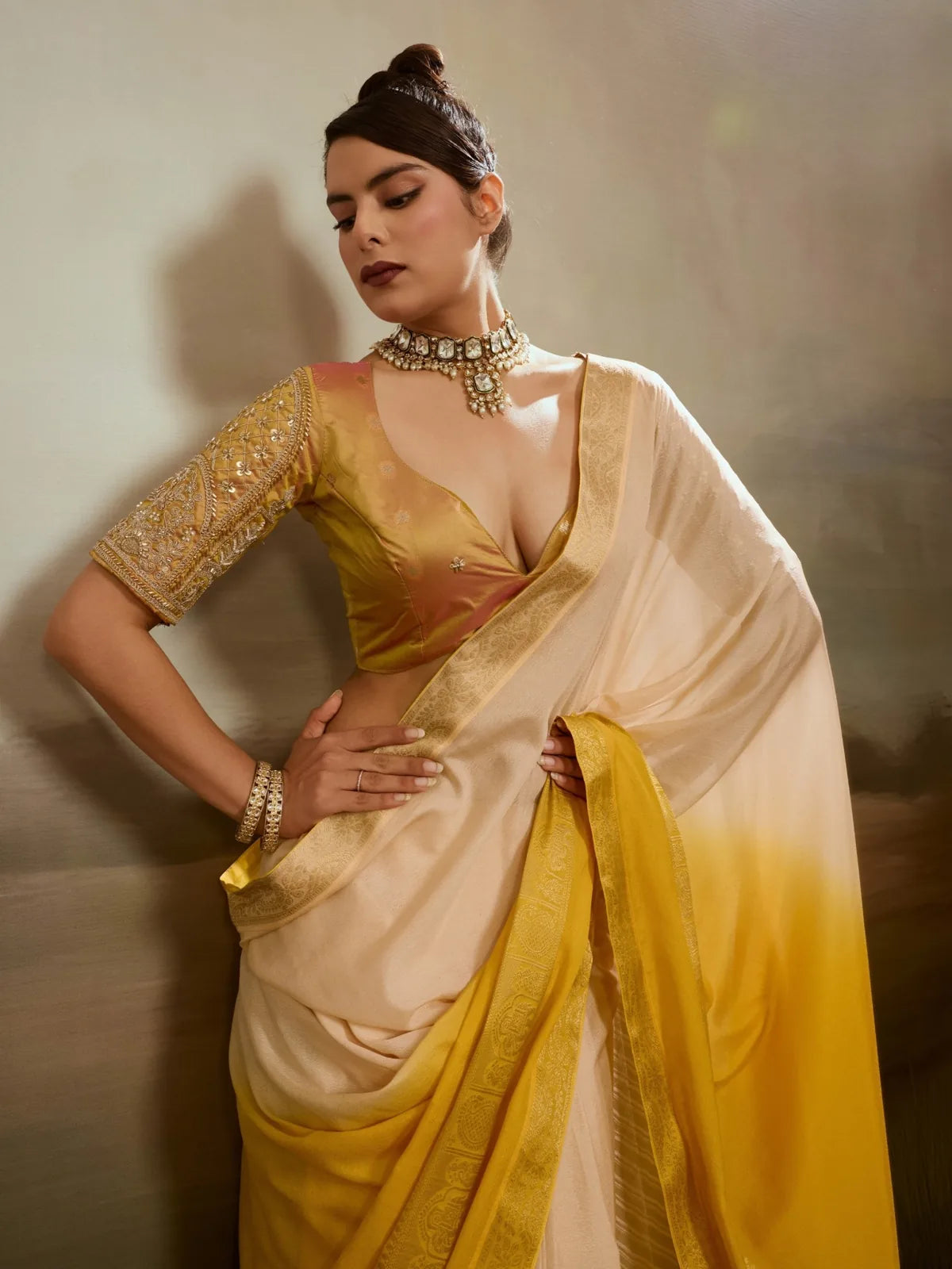 Tarani elegant yellow chiffon saree upper body view with designer blouse