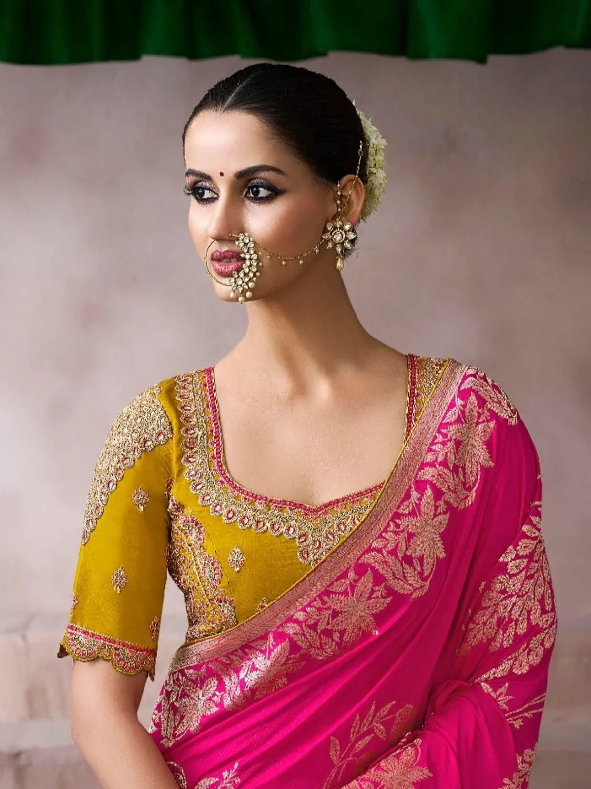 Tarani saree close-up showing mustard blouse with heavy embroidery and front drape