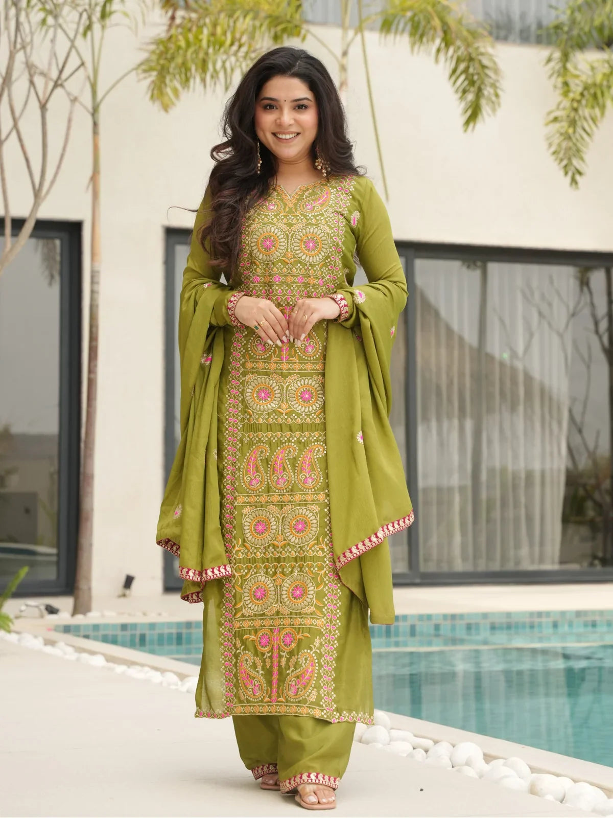Tarani green Chinnon dress with multicolor embroidery and dupatta perfect for festive and wedding wear