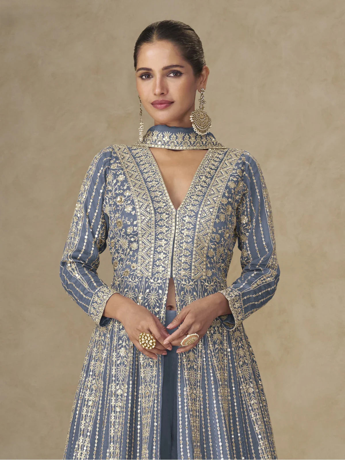 Tarani elegant blue chinnon gown upper body view with V-neck and 3/4 sleeves