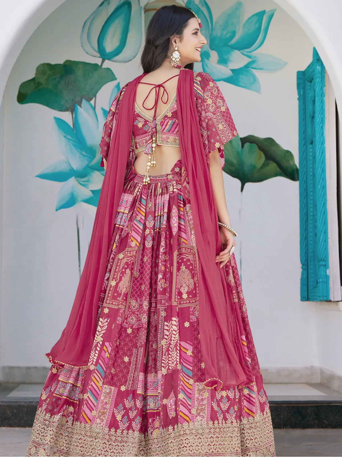 Tarani pink lehenga with back blouse tie-up and chiffon dupatta, back full view
