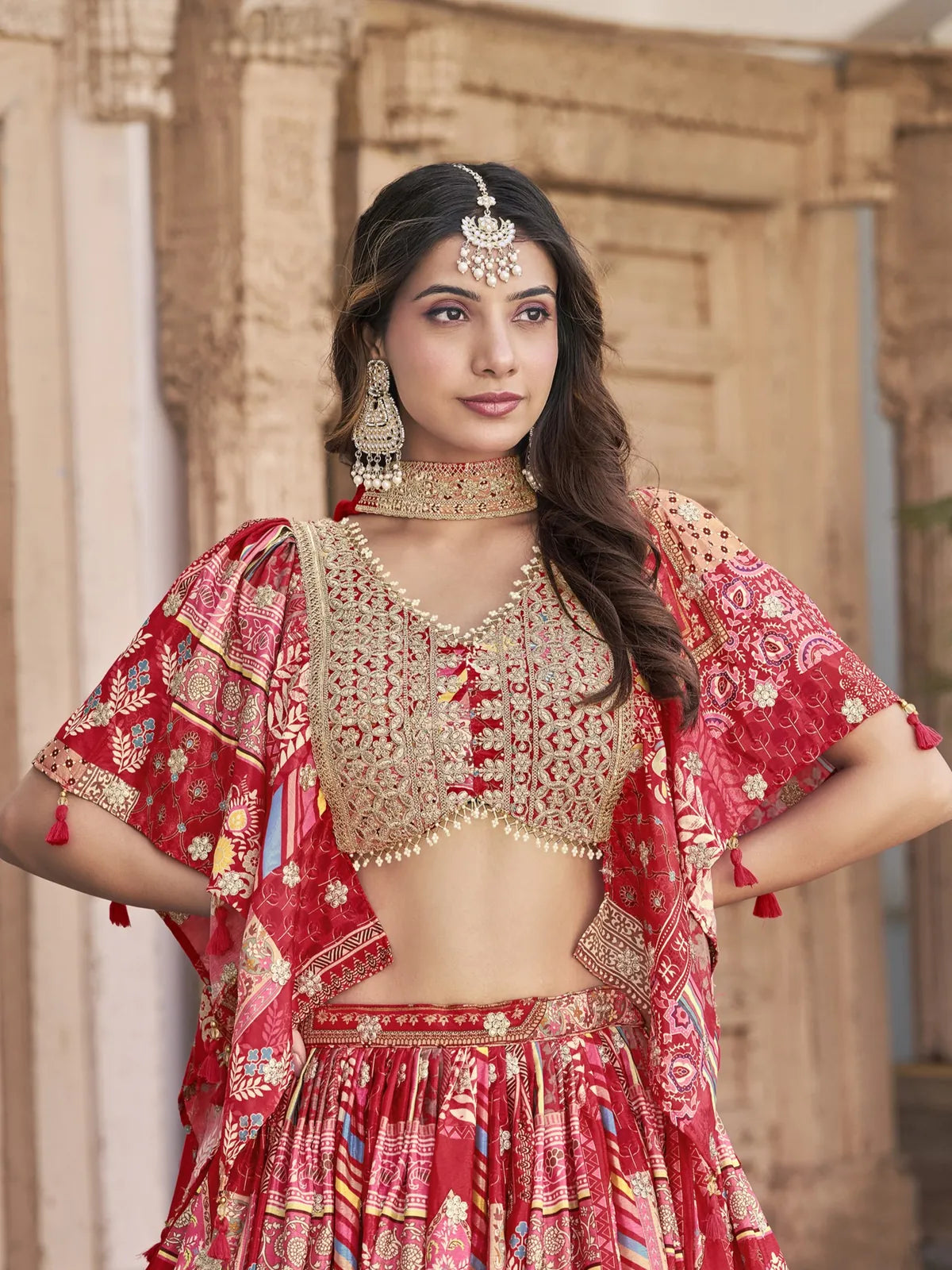 Tarani chinnon lehenga upper body view showing detailed embroidered blouse in festive red