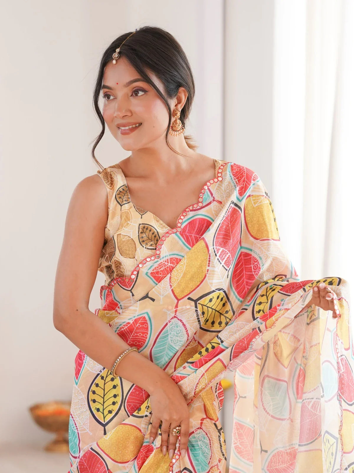 Tarani Chinnon saree worn by Hema showing neckline, pallu pleats and blouse close-up in beige tones