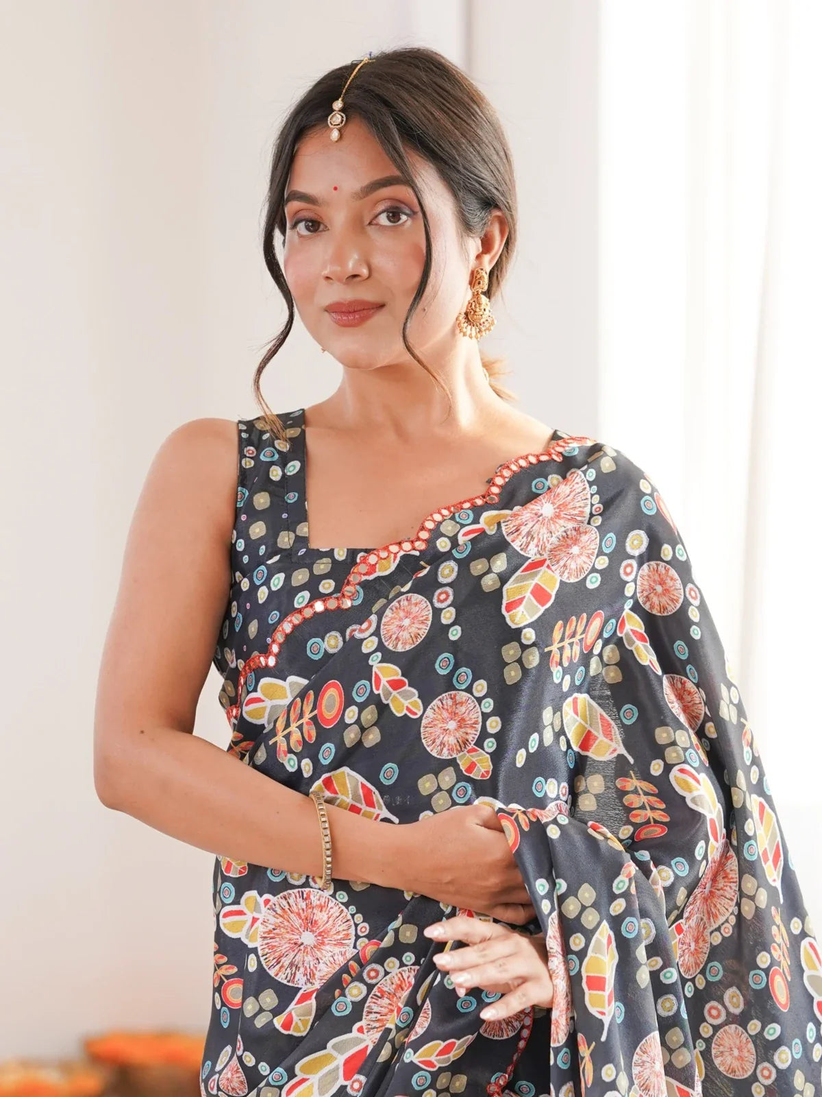 Tarani black chinnon saree upper body view with sleeveless blouse and floral print