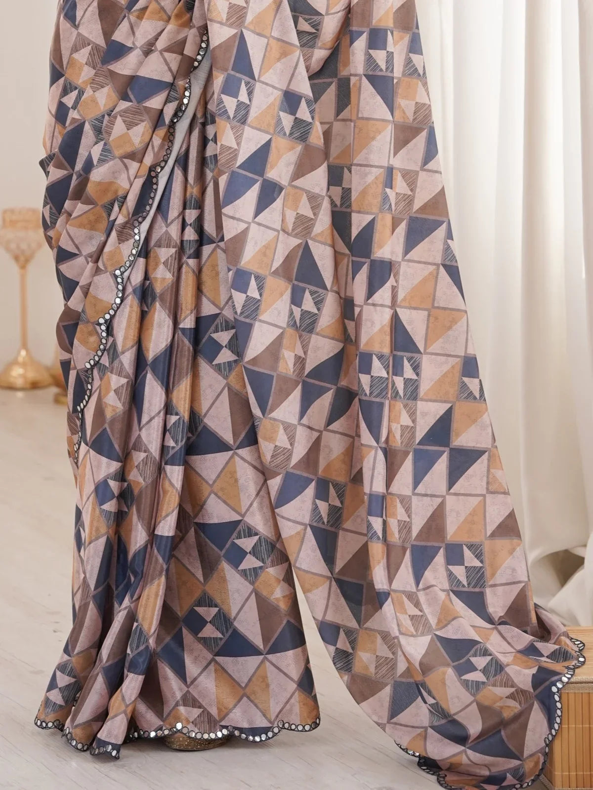 Tarani beige chinnon saree pallu closeup with printed design