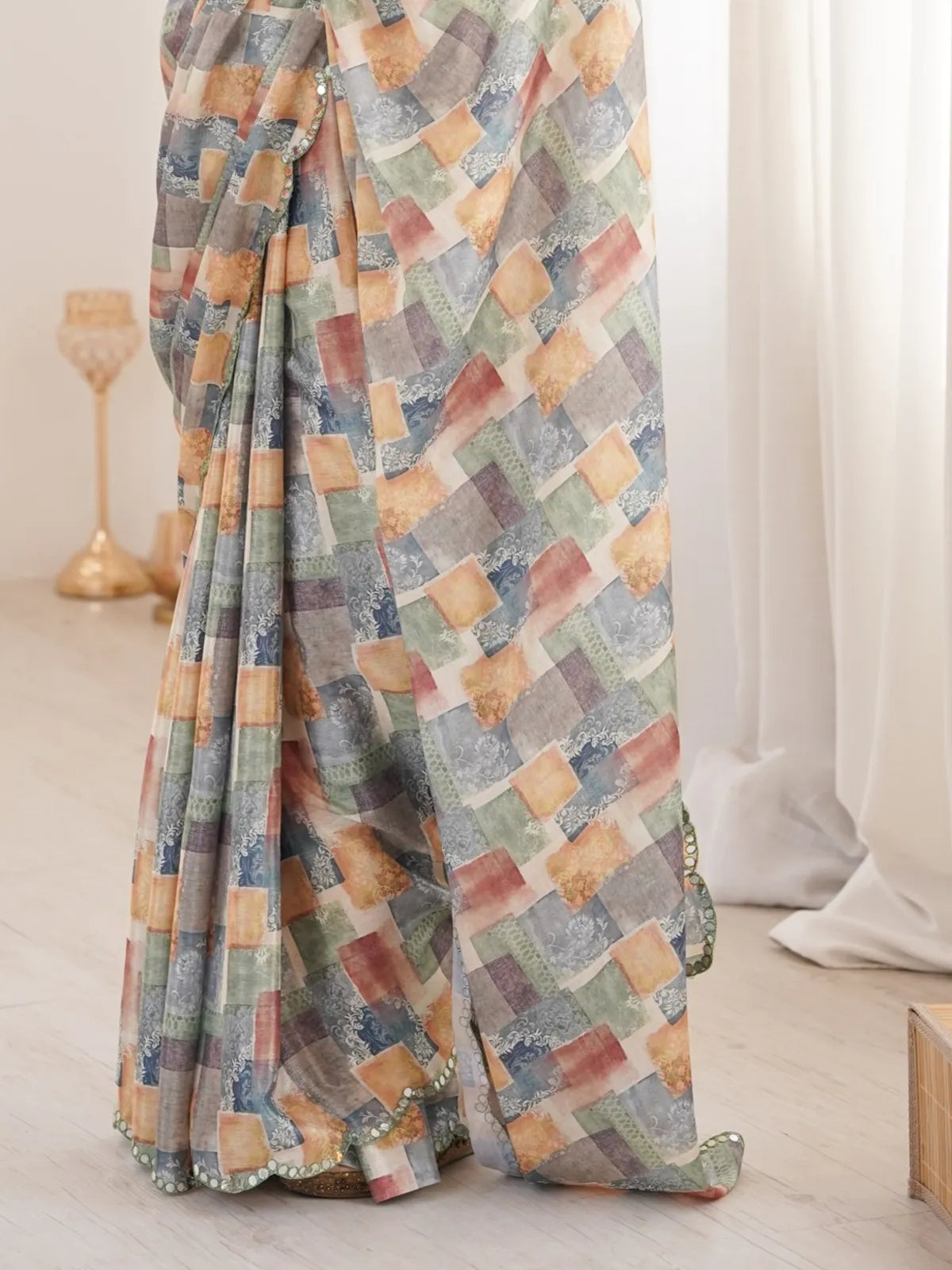 Tarani closeup view of printed chinnon saree with scallop mirror detailing