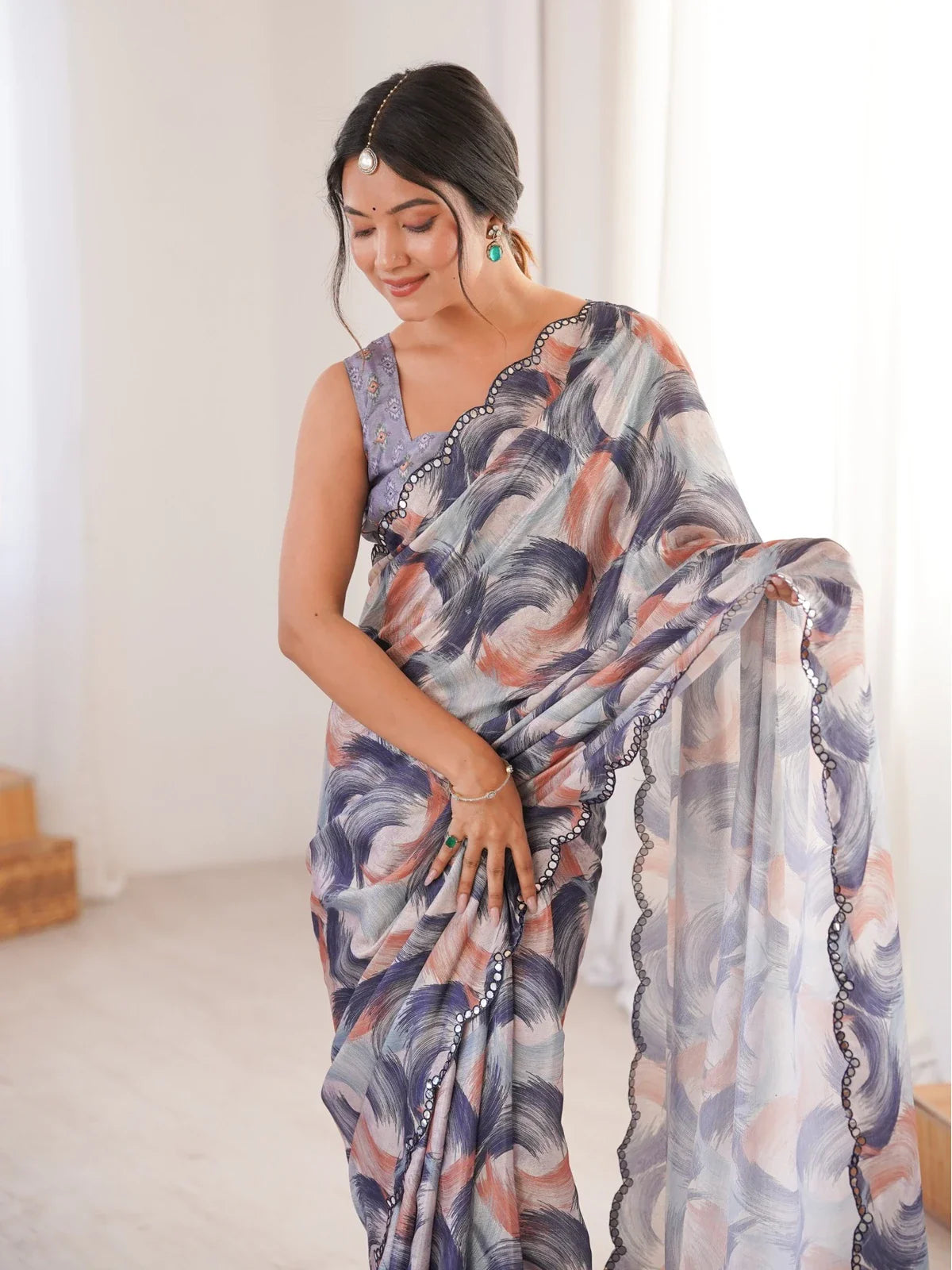 Tarani chinnon saree upper body view highlighting elegant blouse and mirror border