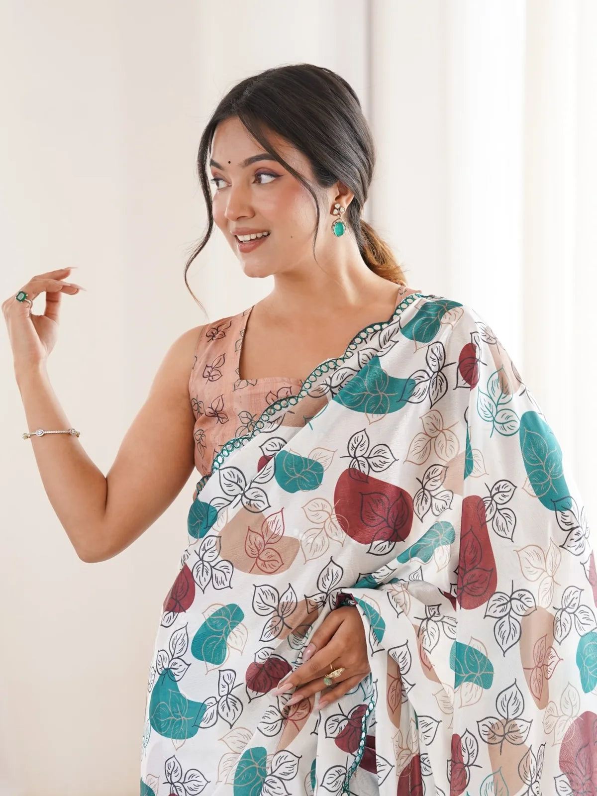 Tarani off white heavy chinnon saree upper-body-view showcasing print and mirror border