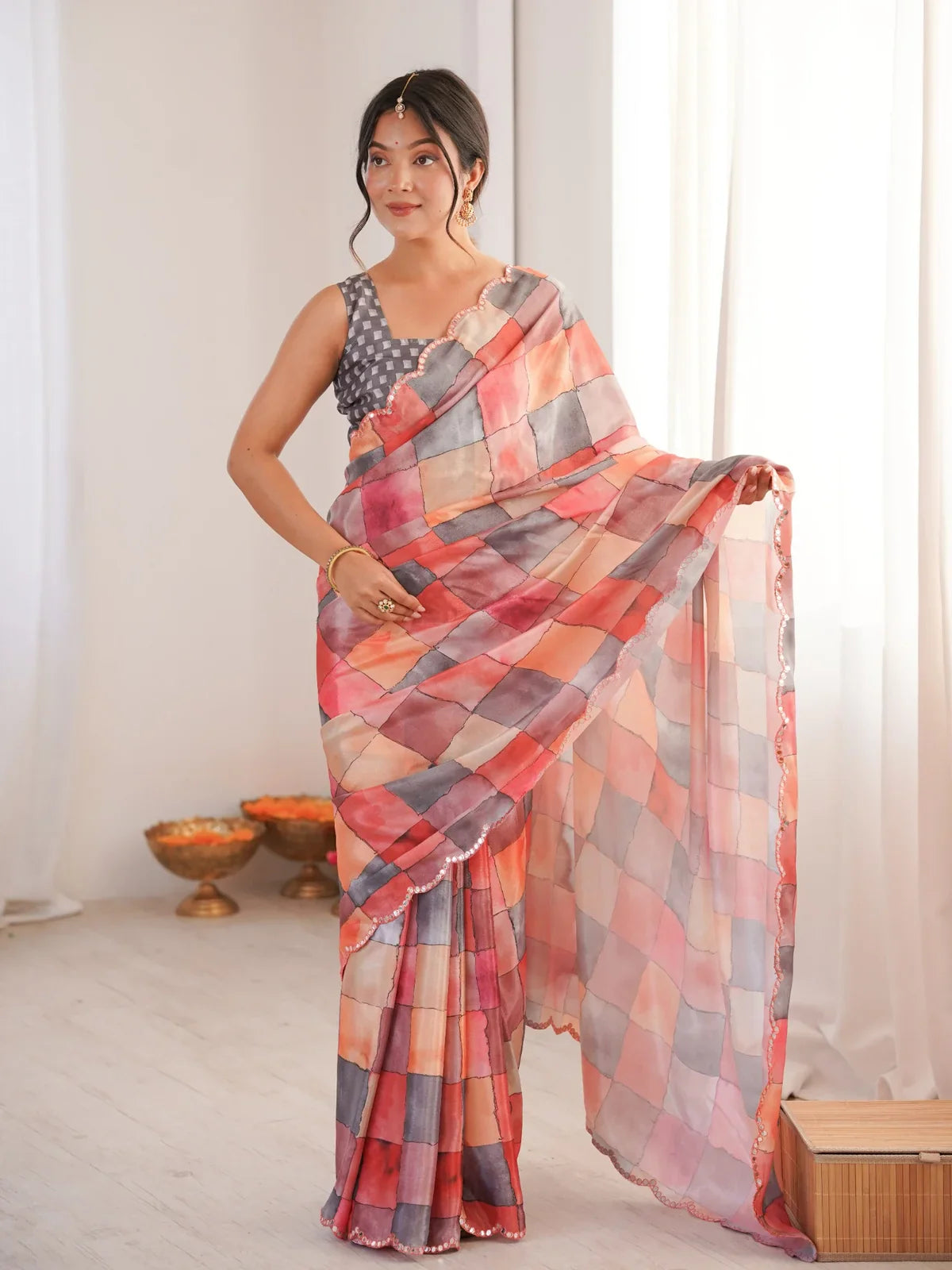 Tarani peach printed chinnon saree full view with elegant mirror work border and soft drape