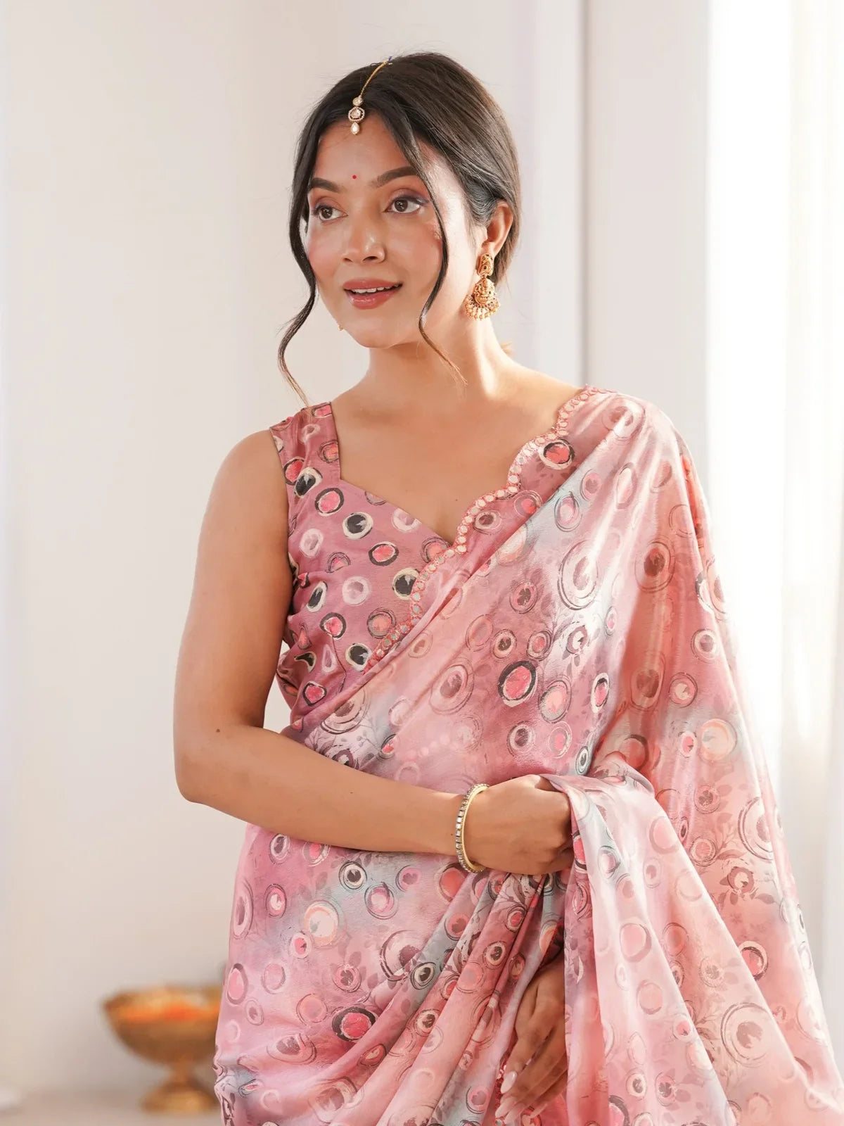 Tarani pink chinnon saree upper body view with mirror work blouse and elegant drape