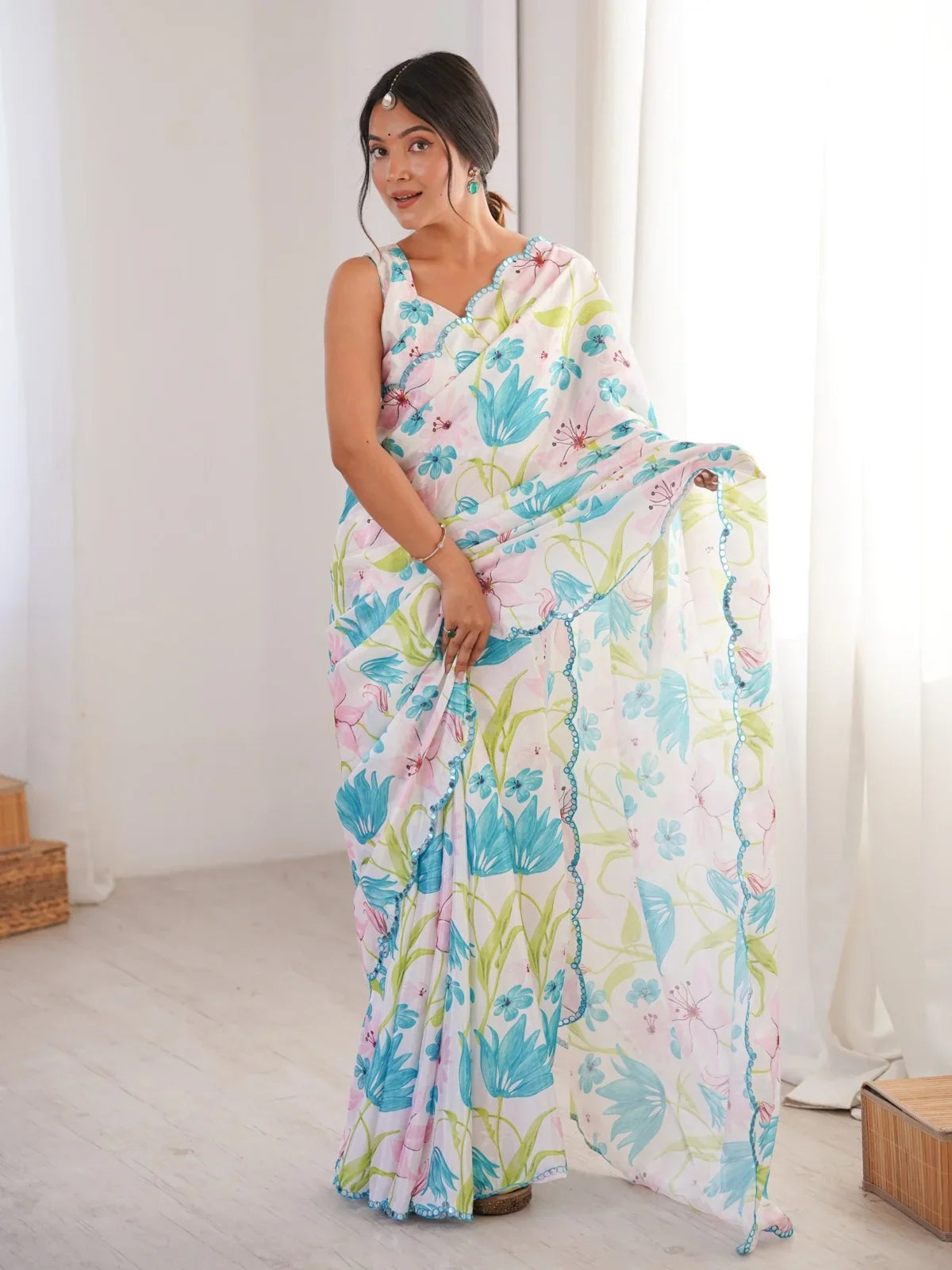 Tarani floral print chinnon saree in white with blue and pink flower motifs and mirror lace for festive and casual wear