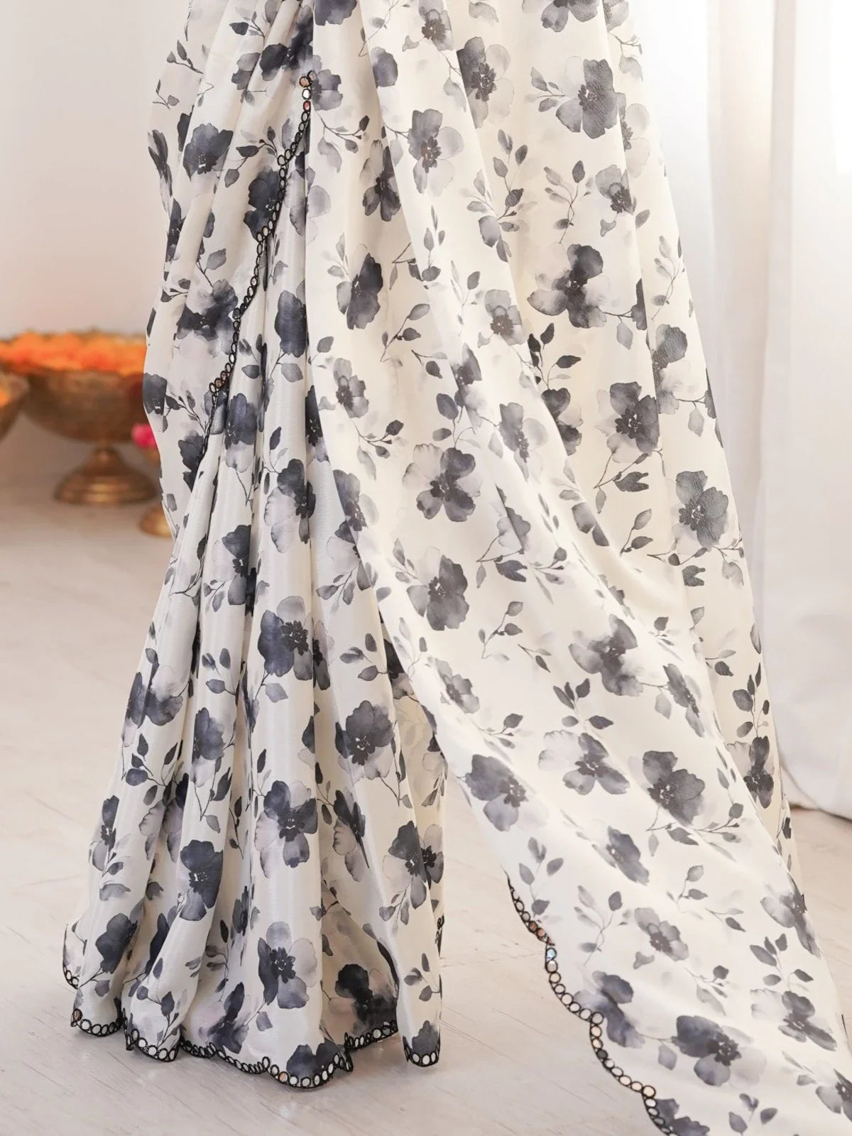 Tarani soft chinnon saree with black floral printed pallu and scalloped mirror work lace