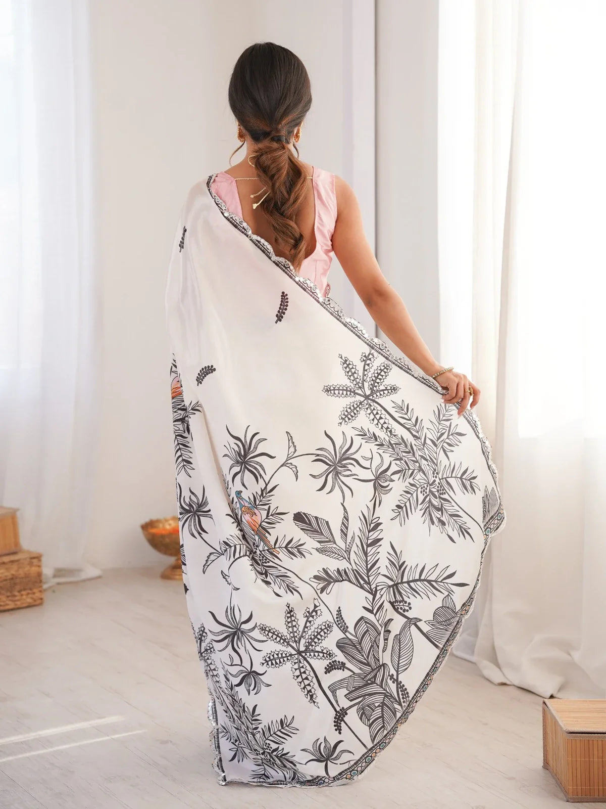 Tarani designer white saree with back pose showing pallu and leaf print - Tanujitika