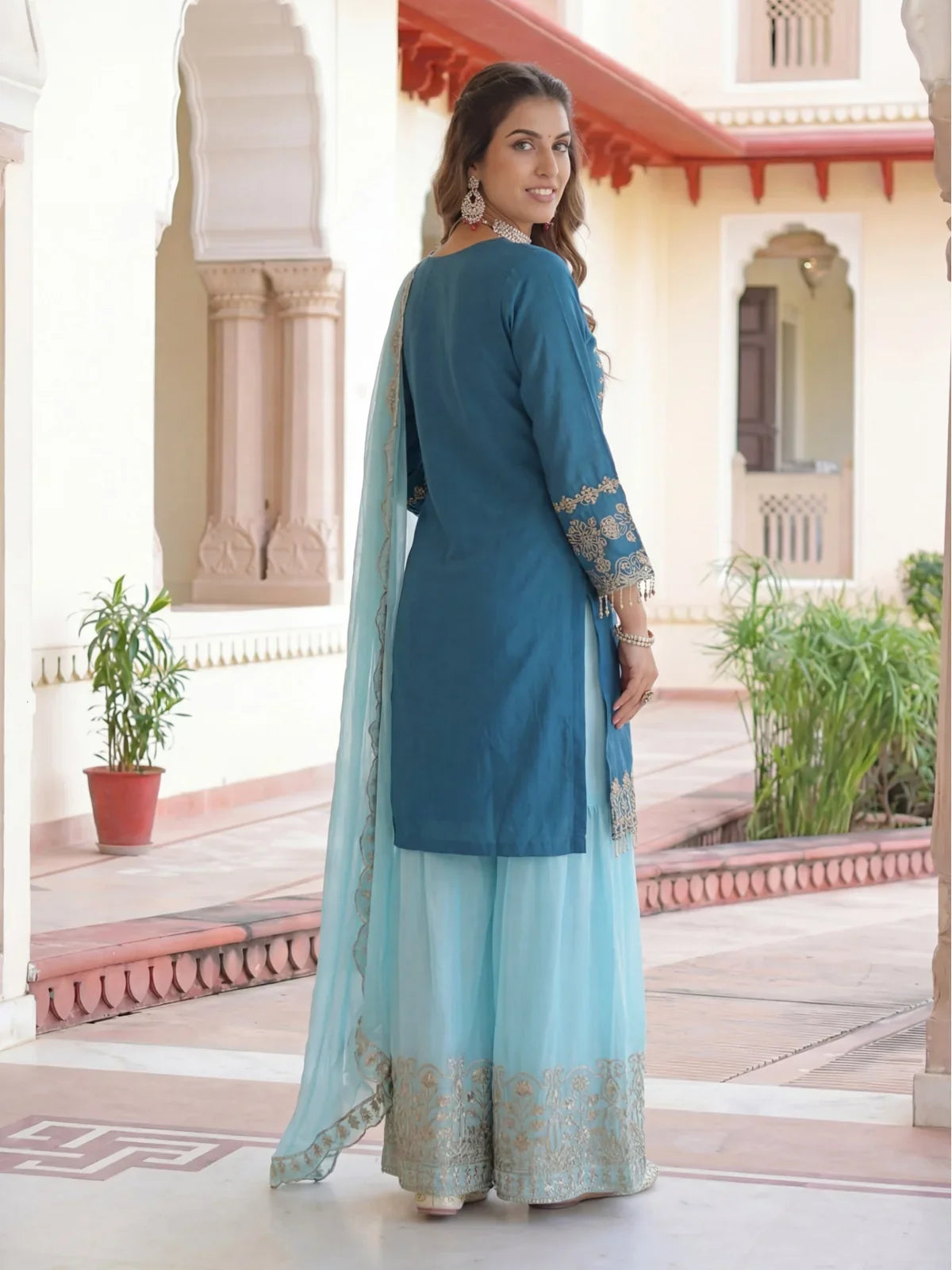 Tarani back view of blue chinon silk embroidered festive dress with palazzo and dupatta
