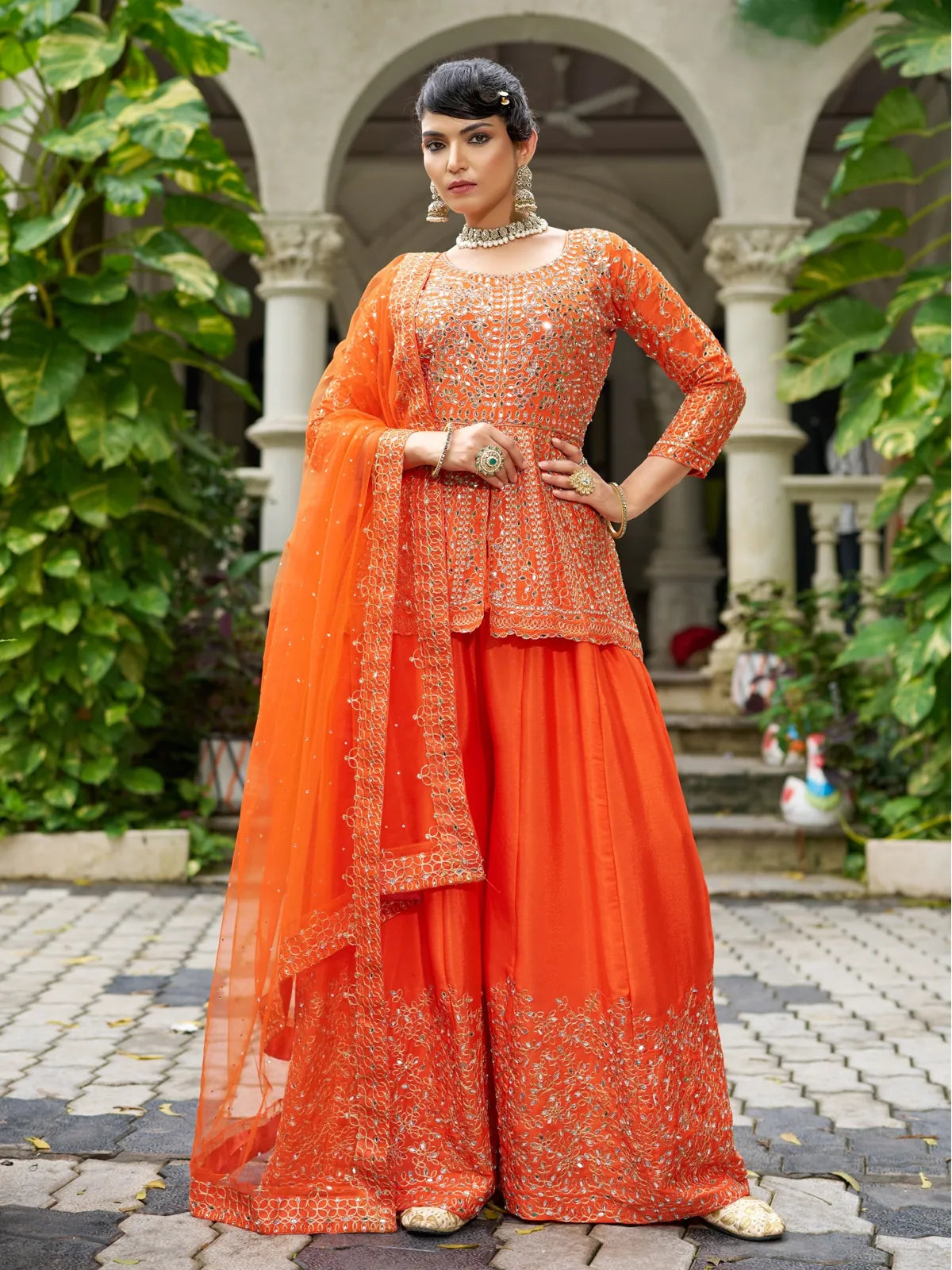 Tarani orange Chinon dress with heavy real mirror embroidery shown in full front pose with sharara and dupatta
