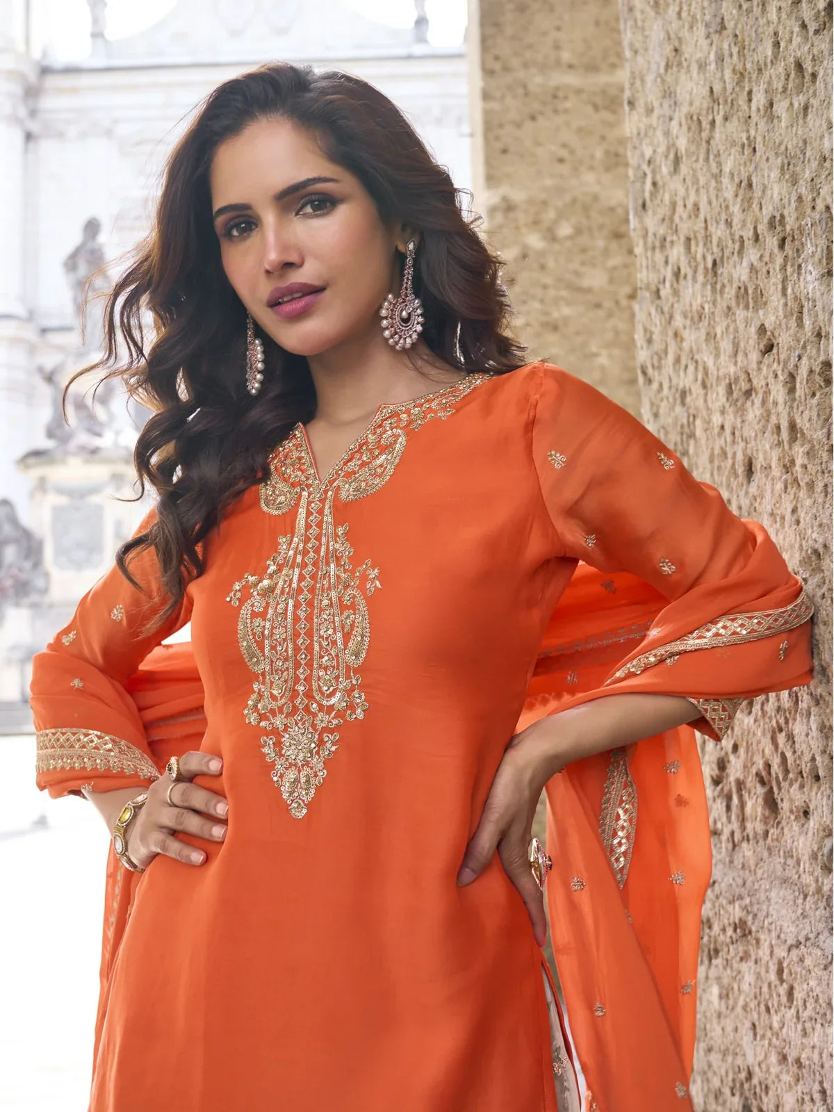 Tarani chinon orange suit upper body view highlighting neckline embroidery and dupatta