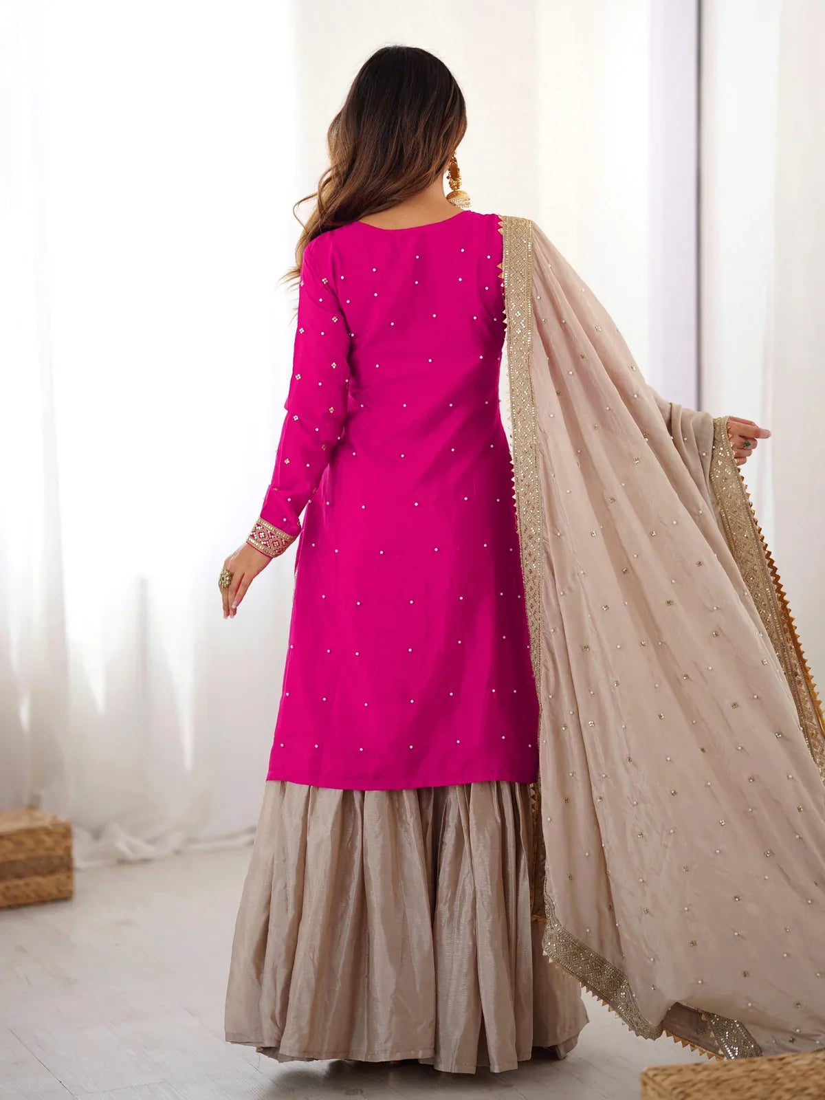 Back view of Tarani pink Chinon dress with sharara and detailed embroidery for weddings