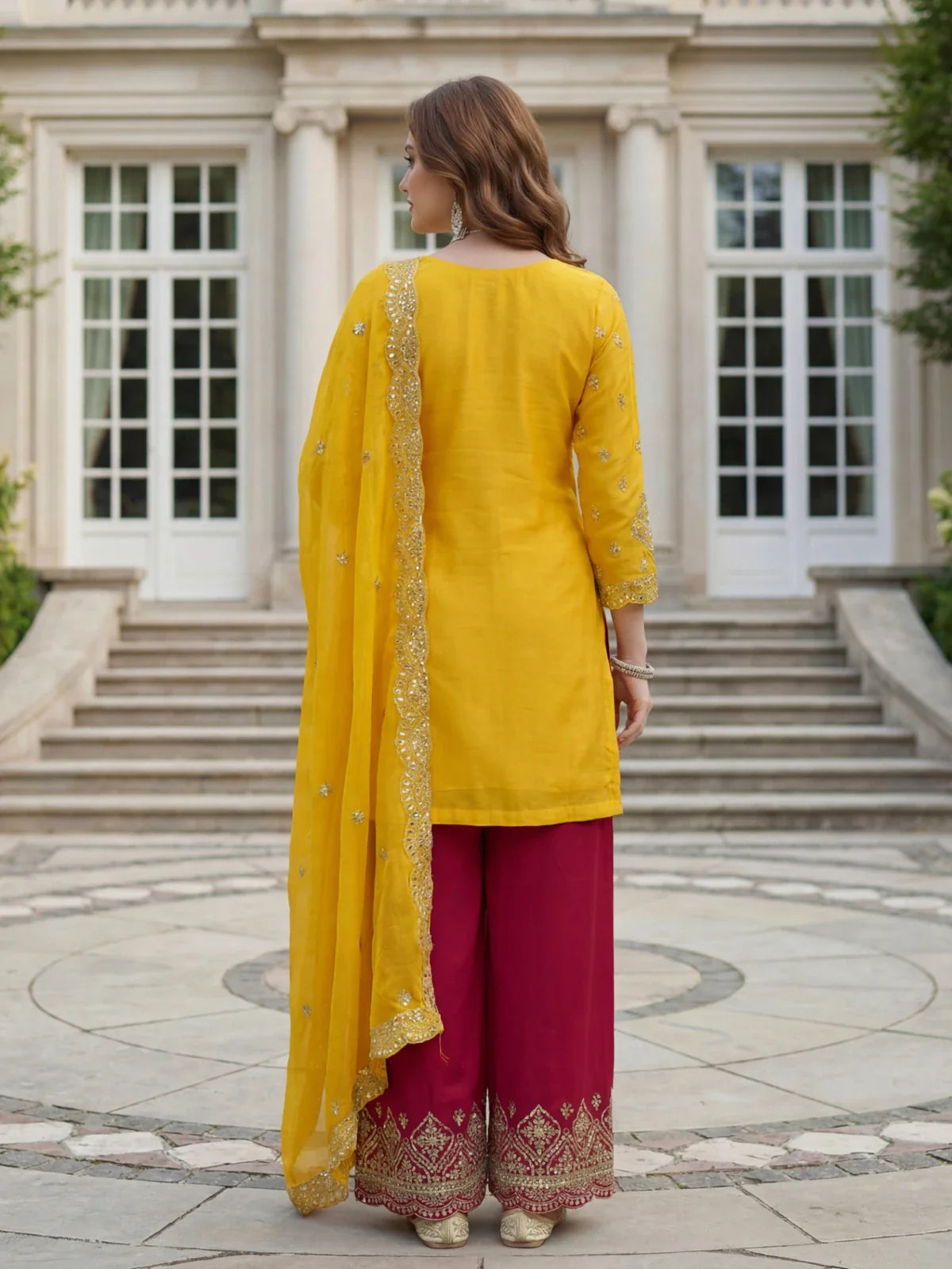 Back view of Tarani festive yellow chinon silk palazzo dress with dupatta and handwork details