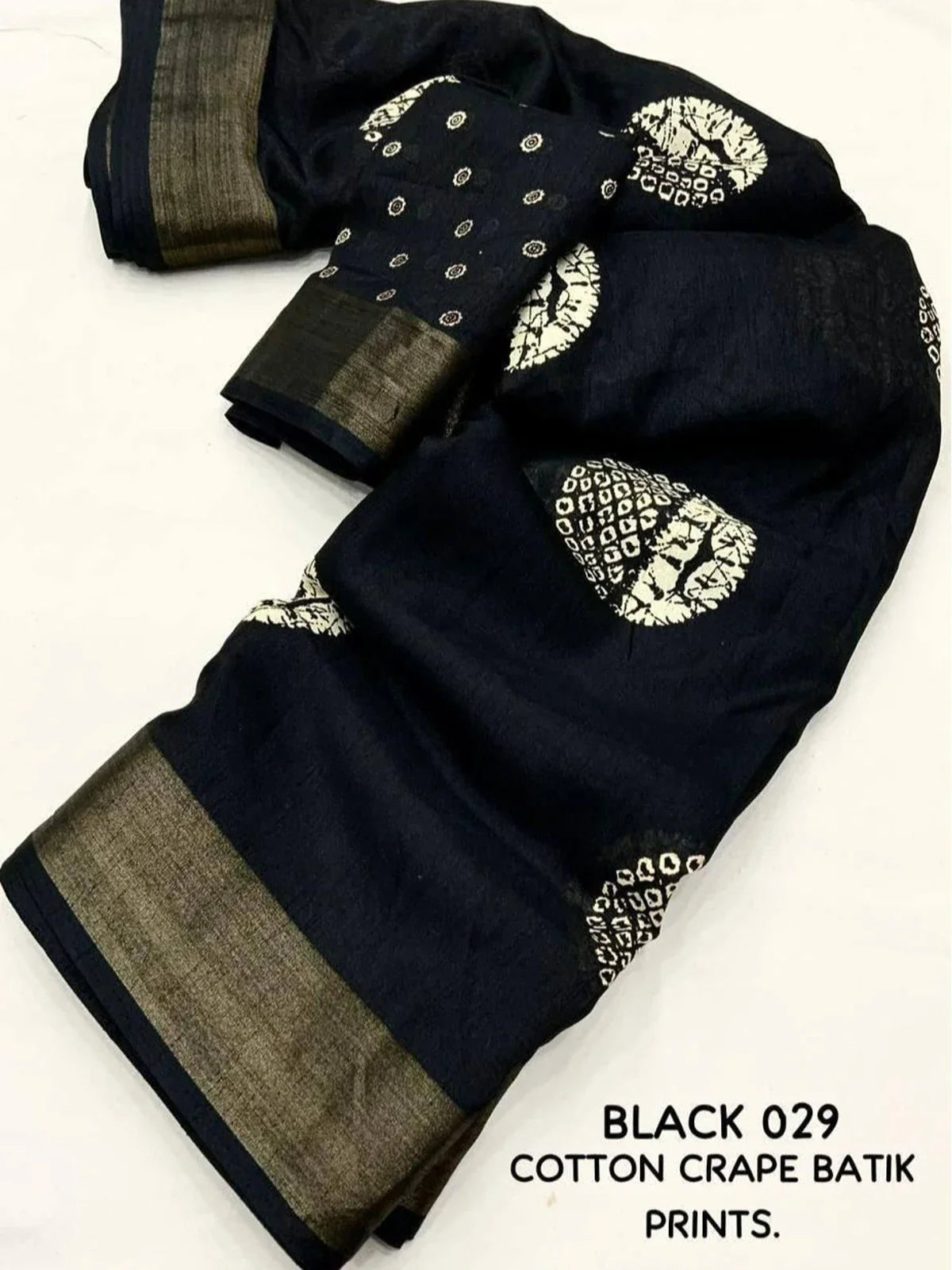 Tarani festive black batik cotton crape saree pallu view with golden border design