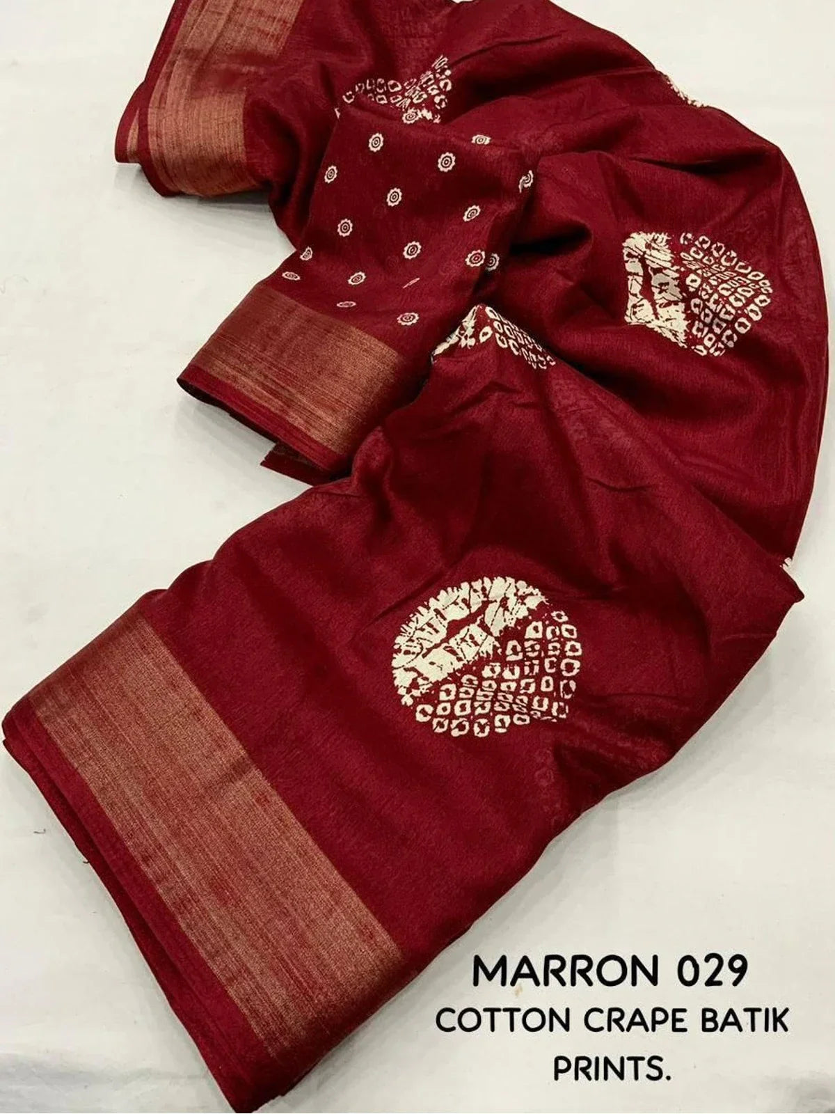 Tarani maroon cotton crape saree pallu view with fine batik prints and graceful drape