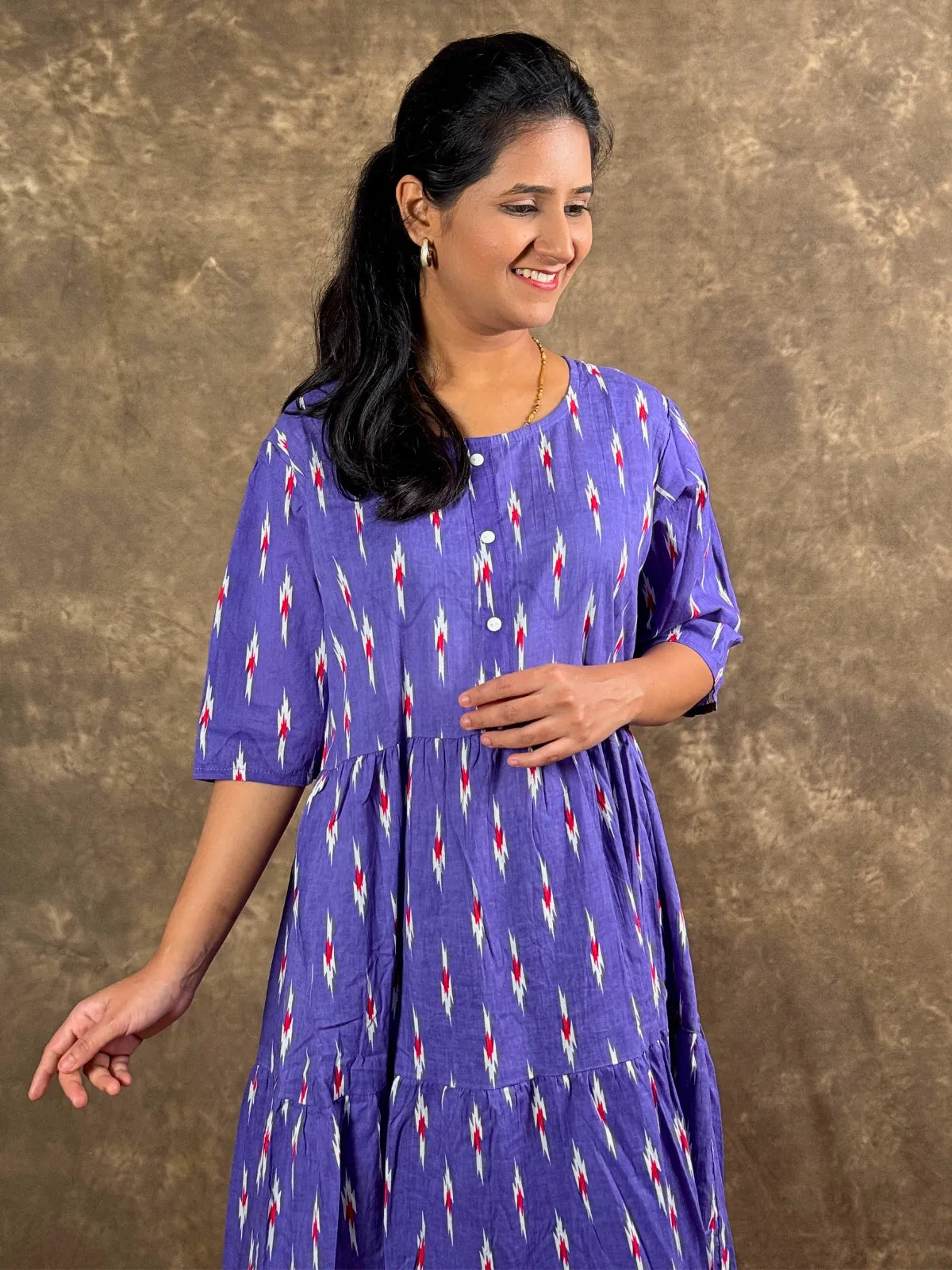 Tarani purple cotton midi dress upper body view with round neck and three quarter sleeves