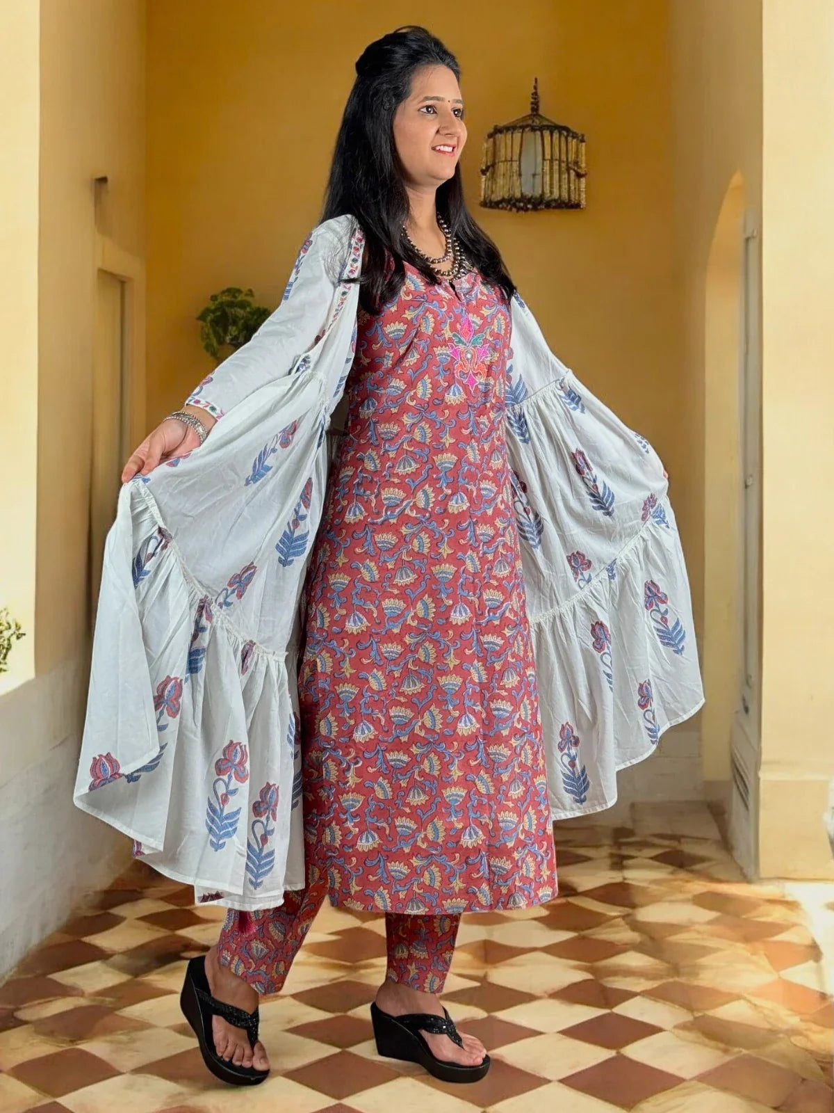 Tarani red cotton pant kurti and shrug set front view with printed kurti and flowing shrug