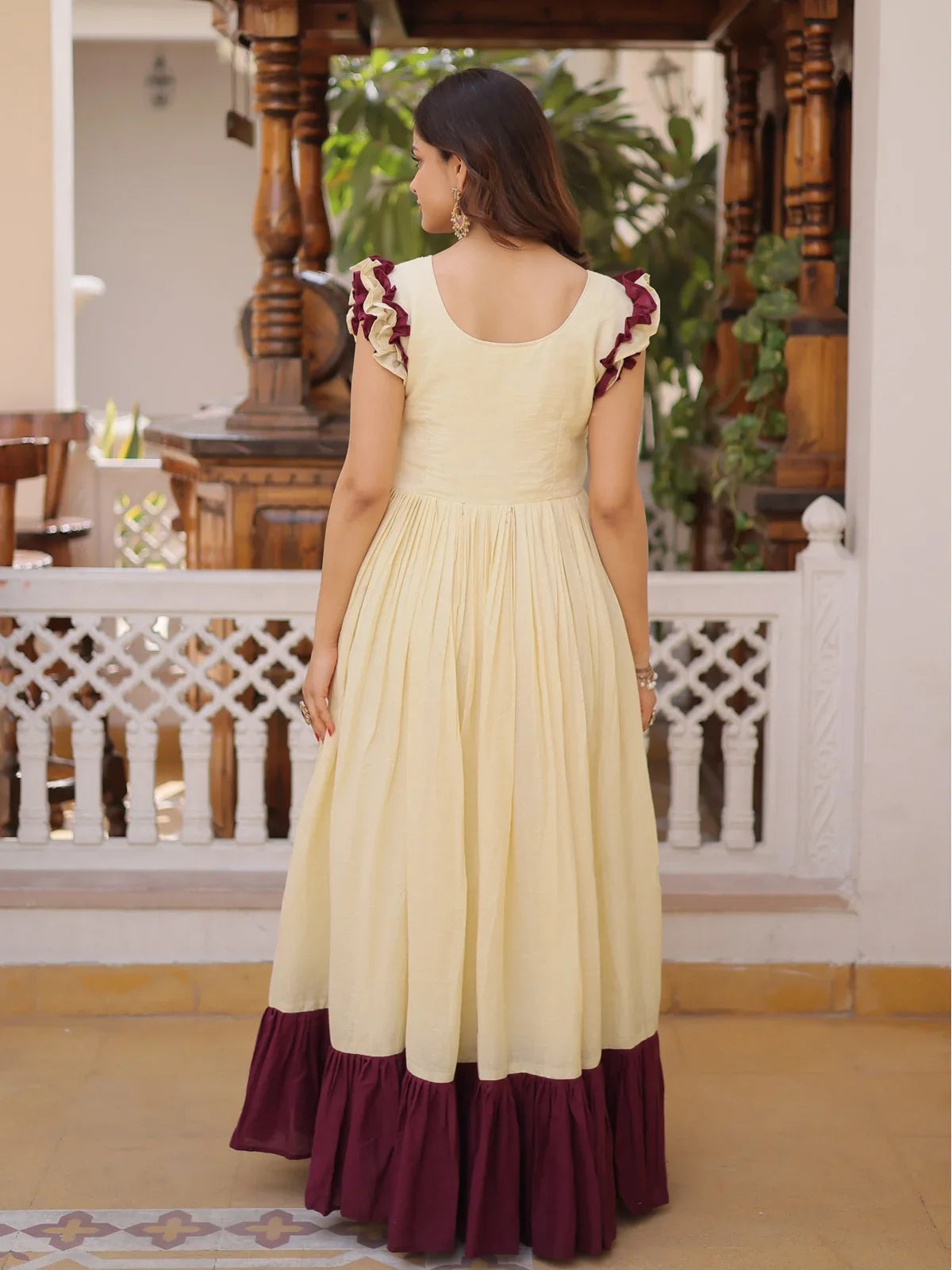 Tarani yellow cotton gown back view with gathered flare and elegant neckline
