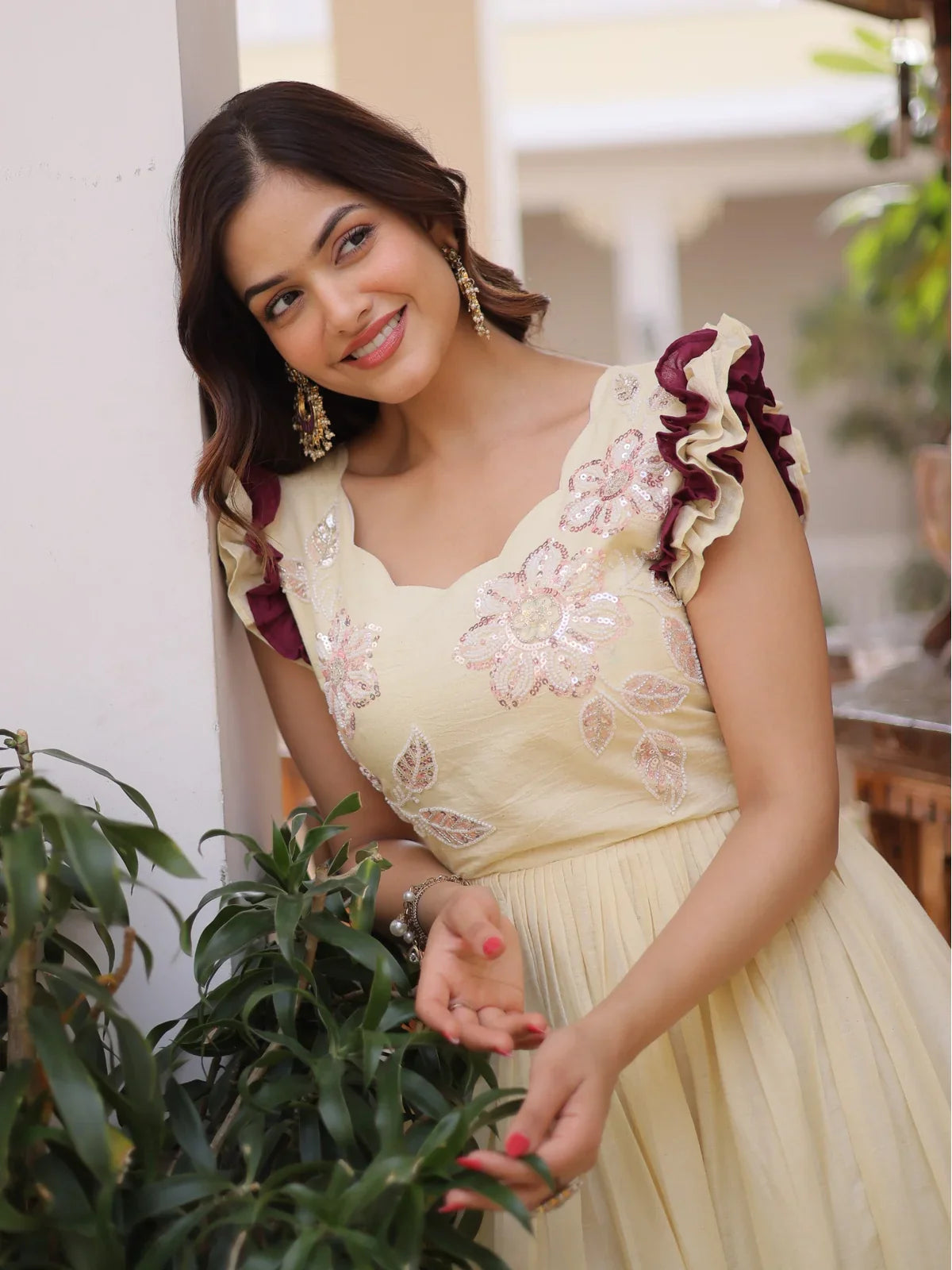 Tarani yellow cotton gown upper body closeup showing floral embroidery and designer ruffle sleeves