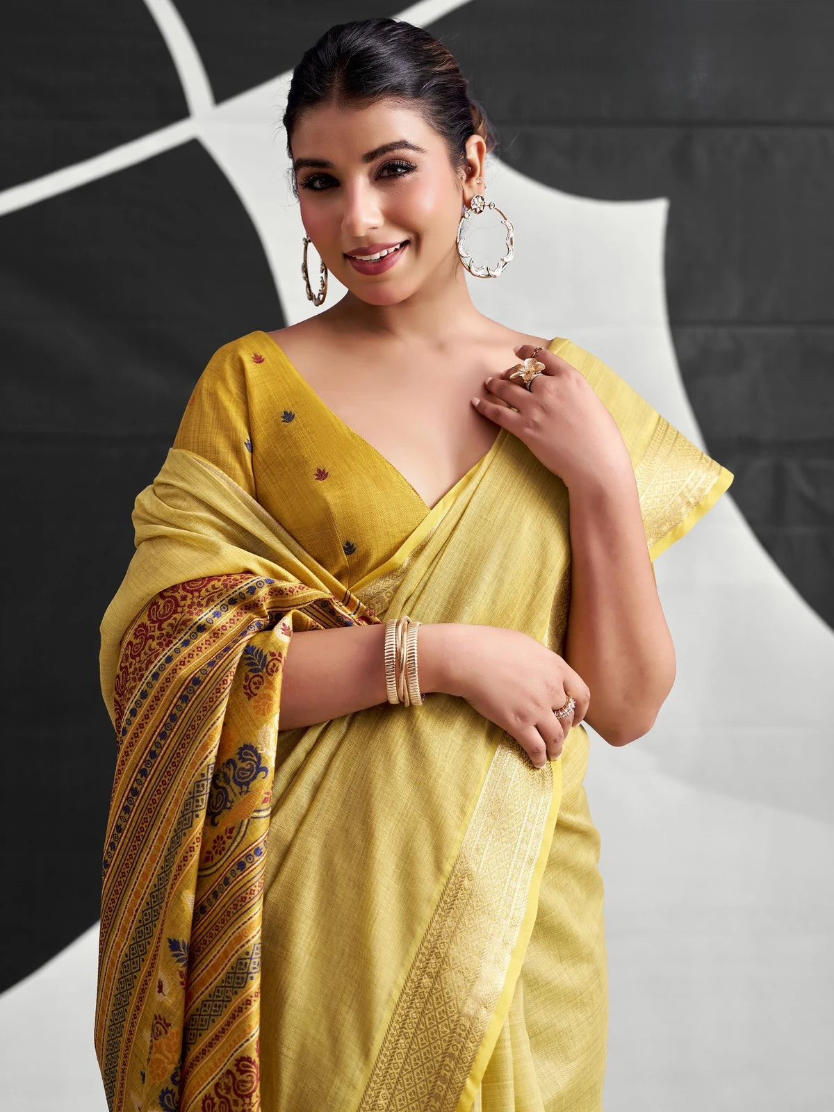 Tarani mustard cotton modal saree upper-body-view with woven border and contrasting printed pallu