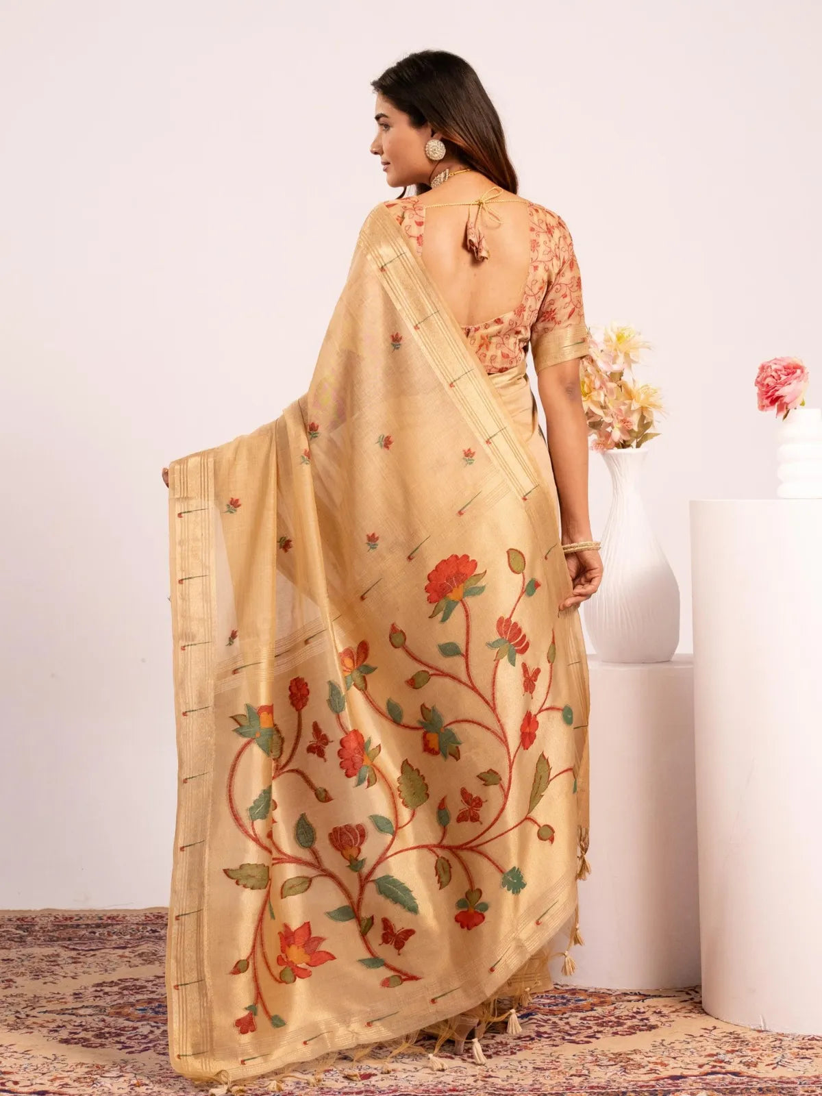 Tarani paithani saree back view showing red woven blouse design and deep cut pattern