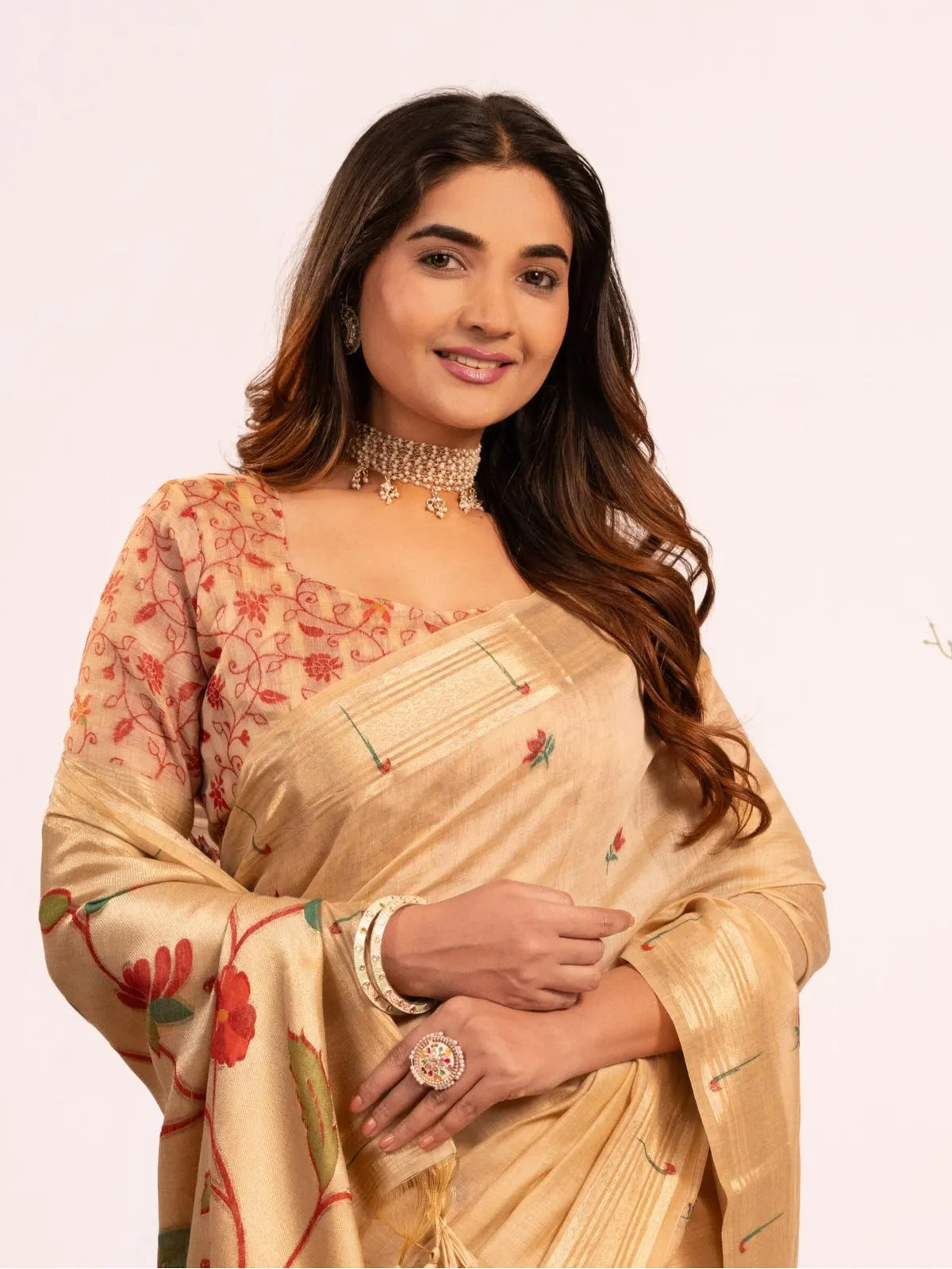 Tarani cotton paithani saree close upper-body view with contrast blouse and muniya work