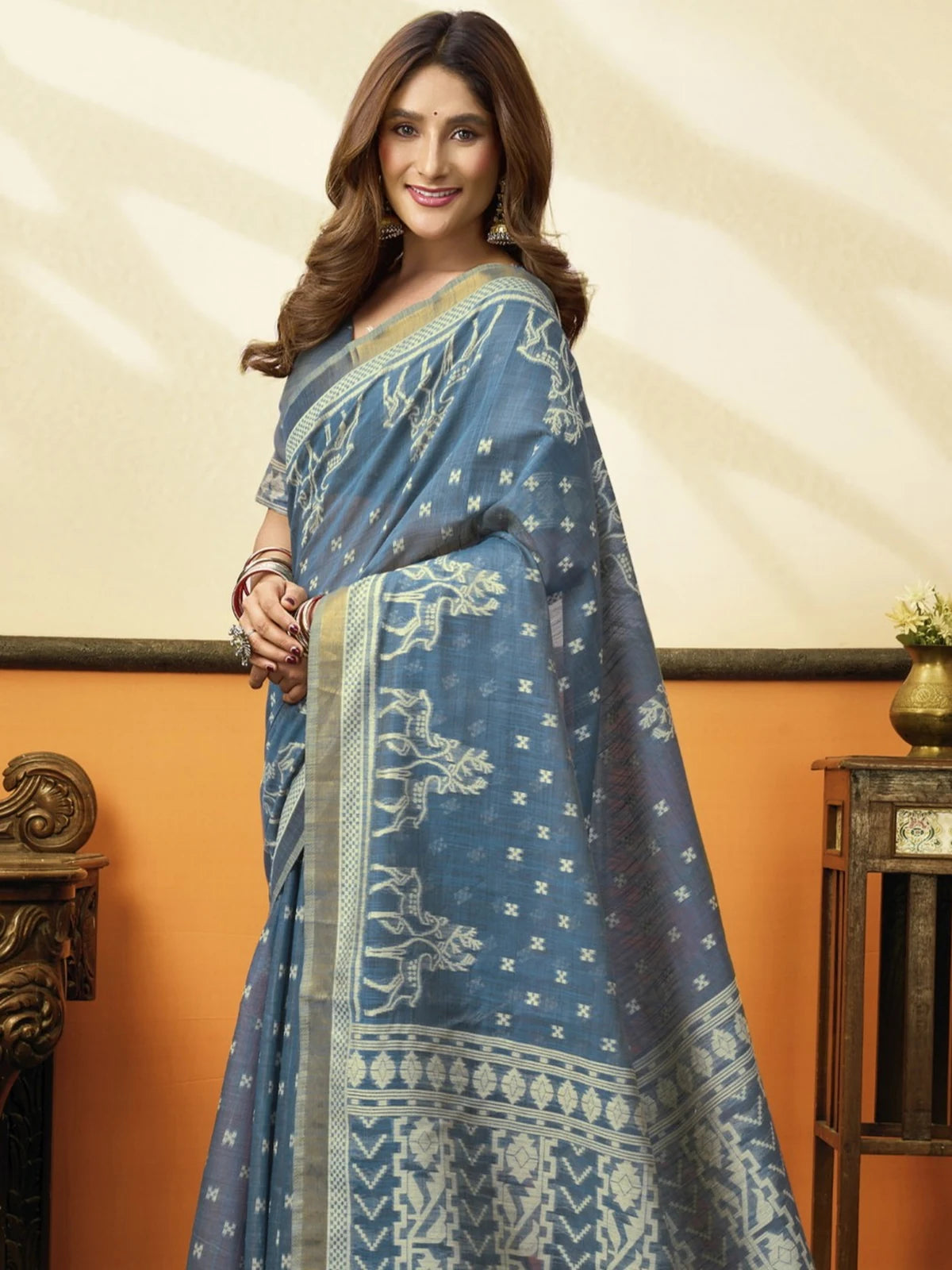 Tarani premium blue cotton saree front view with elegant drape and woven motifs