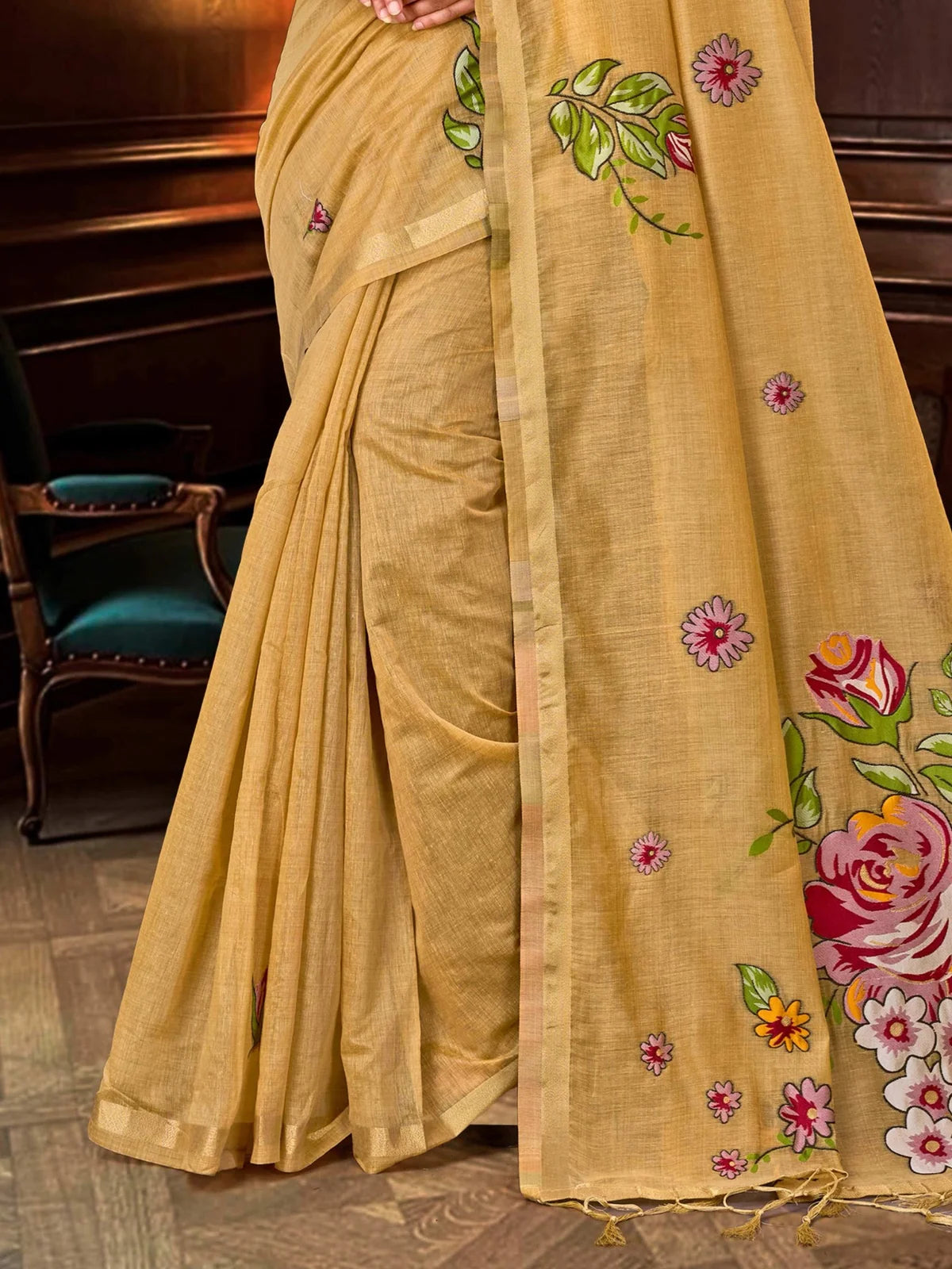 Tarani golden cotton blend saree closeup showing floral design and zari border