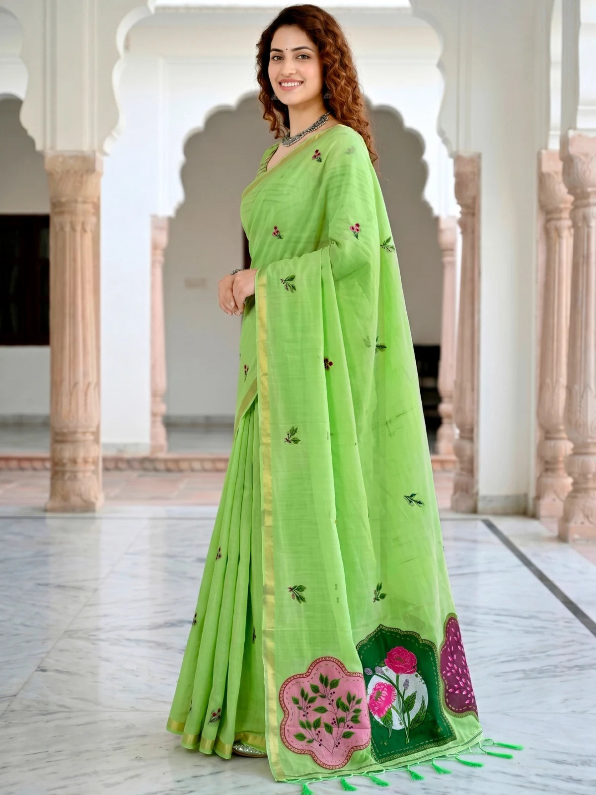 Tarani Nistha green cotton saree side view with elegant drape and floral woven detailing
