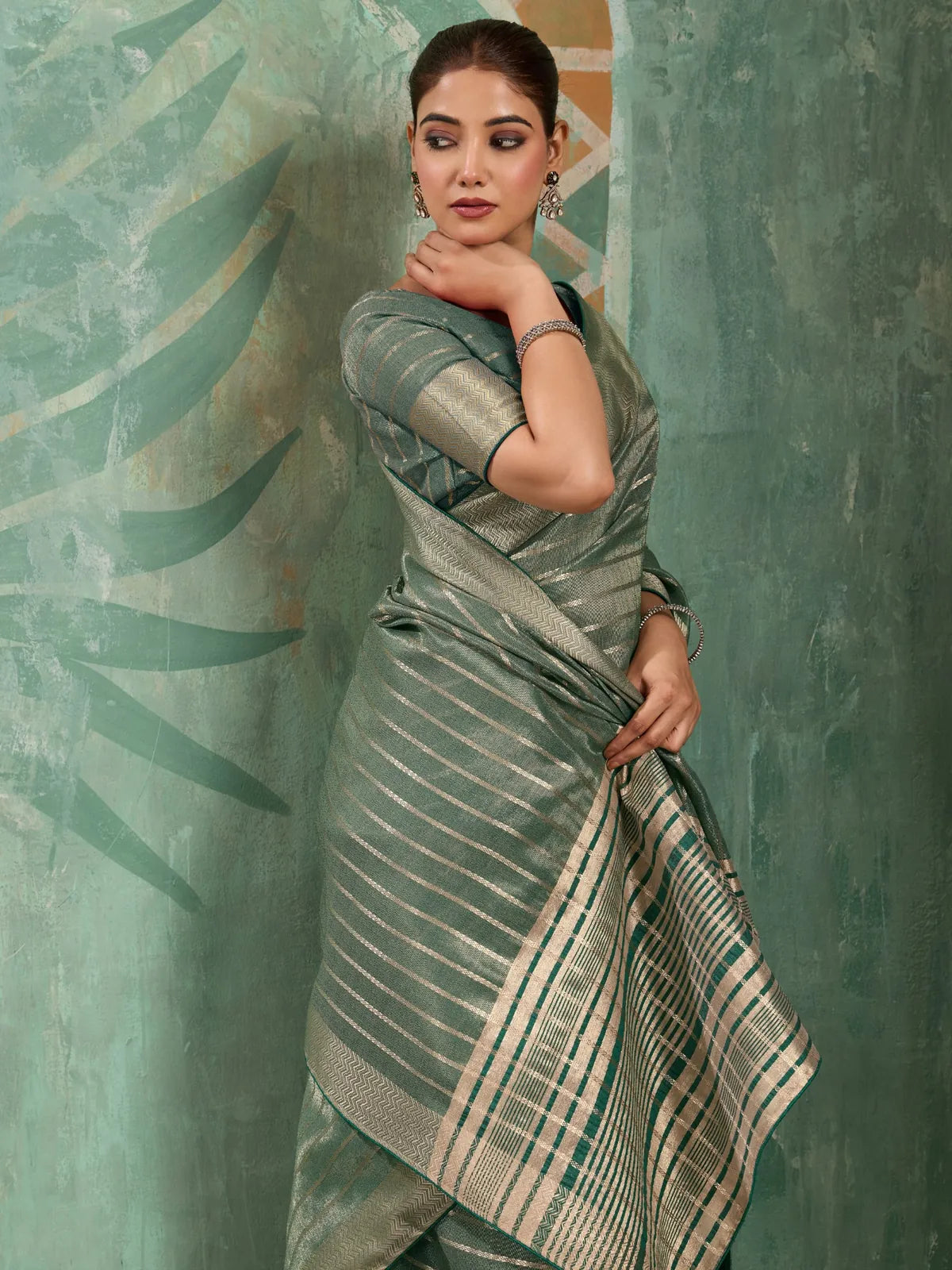 Tarani green cotton tissue saree with zari woven work side view