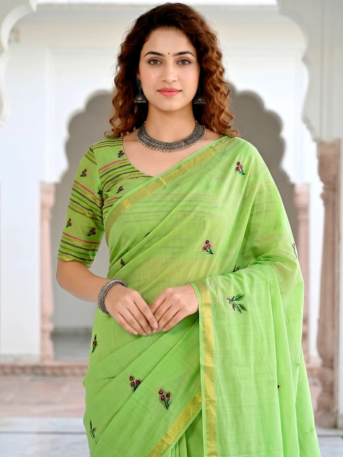 Tarani Nistha green cotton saree upper body view with woven floral motifs and blouse design