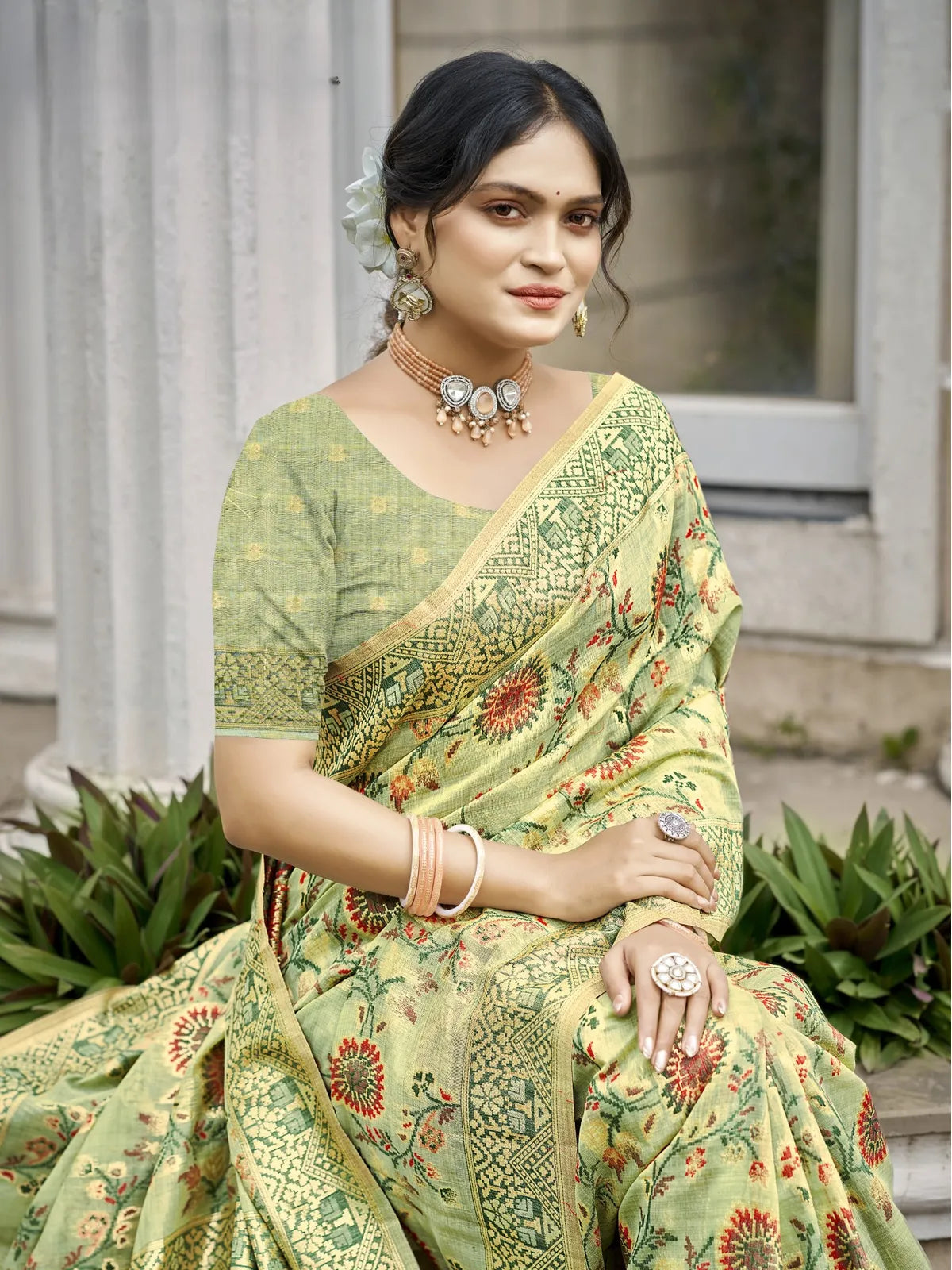 Tarani cotton silk saree in green with floral weave shown in upper body view