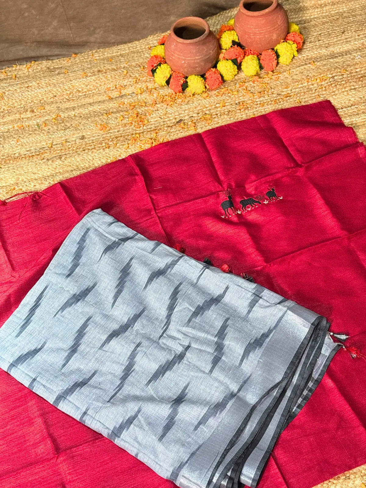 Tarani grey woven silk saree closeup view with blouse piece folded