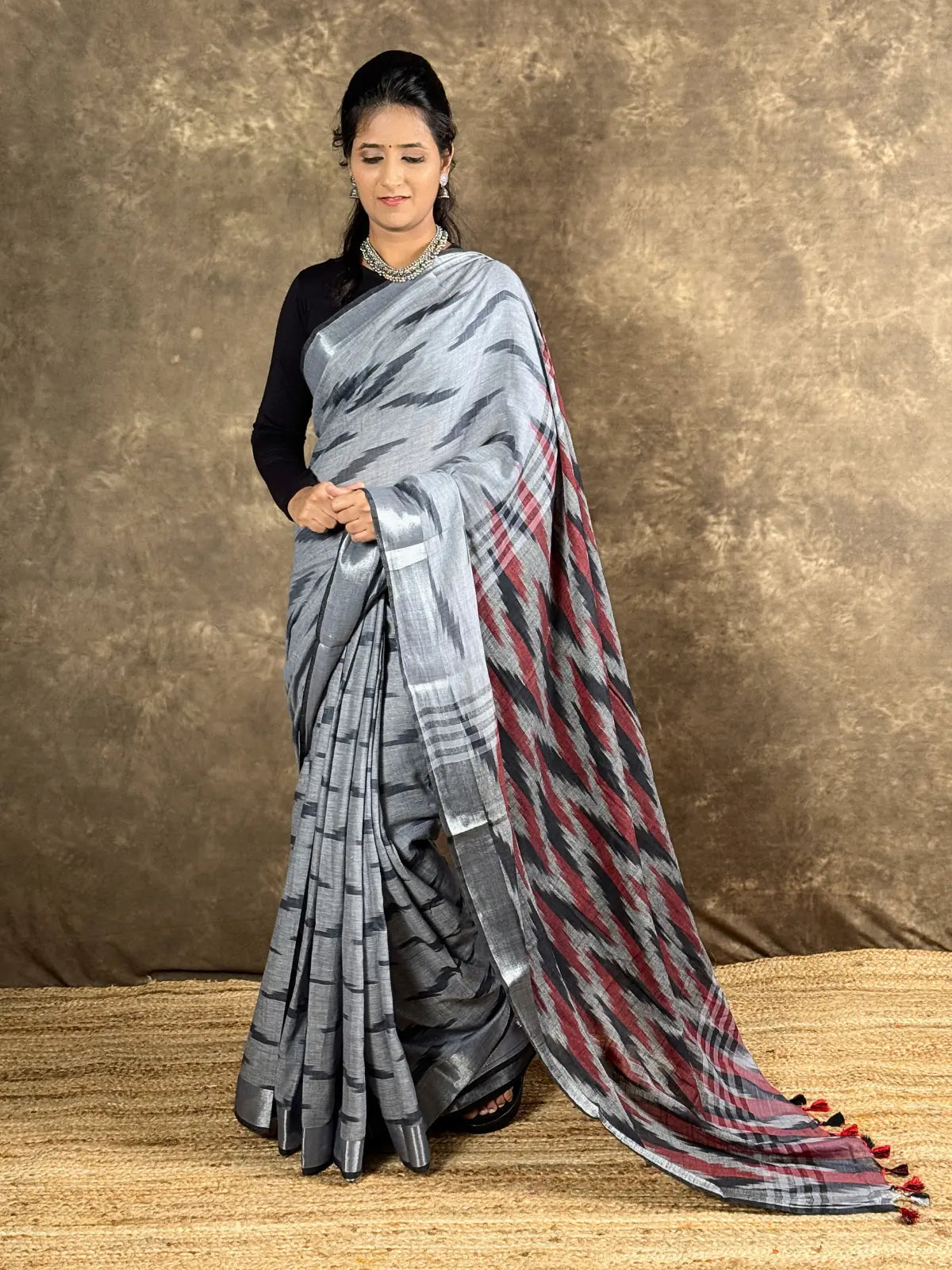 Tarani grey woven silk saree front view with red pallu highlights