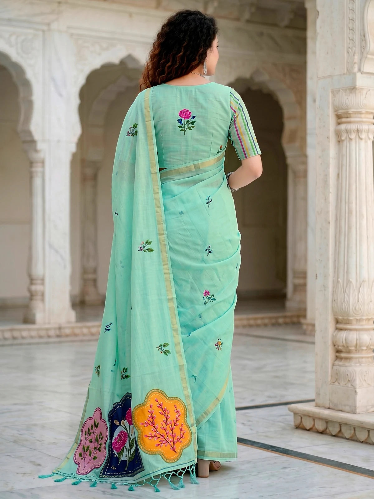Tarani mint green cotton saree back-view showing woven floral work