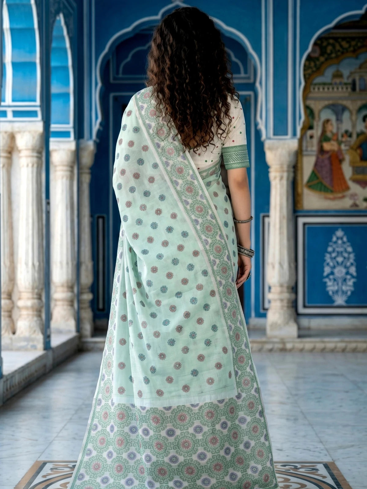 Tarani mint green printed cotton saree back view with blouse piece
