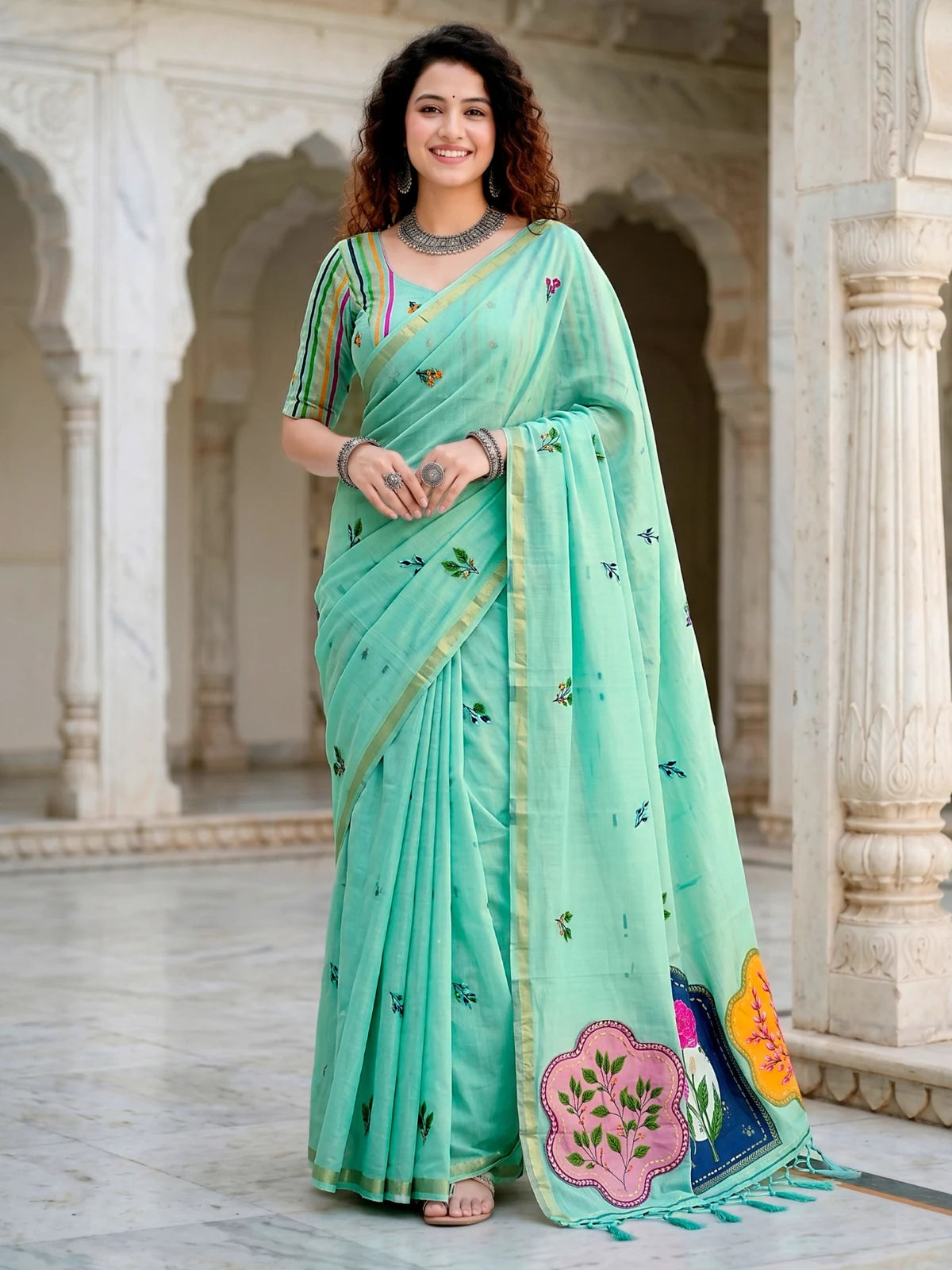Tarani mint green cotton saree full front view with woven floral work and contrast border