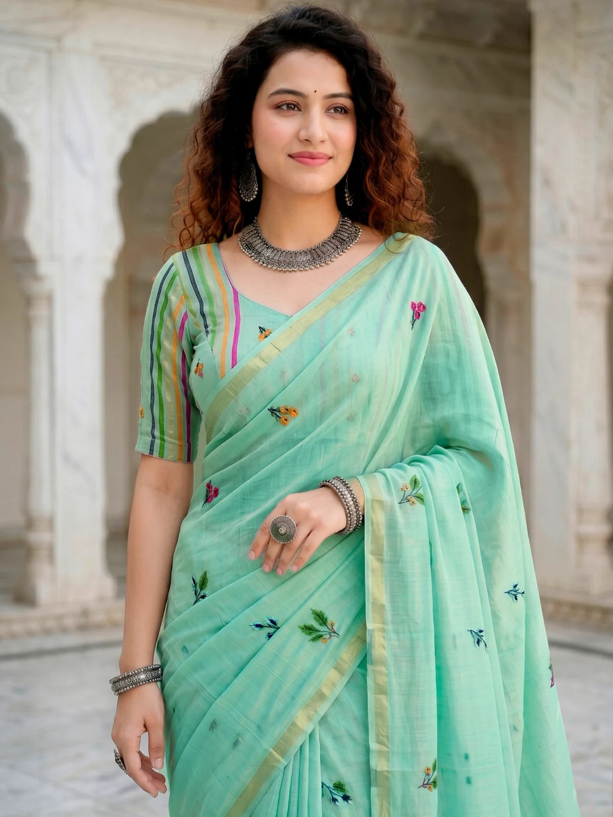 Tarani mint green cotton saree upper-body-view showing woven floral work