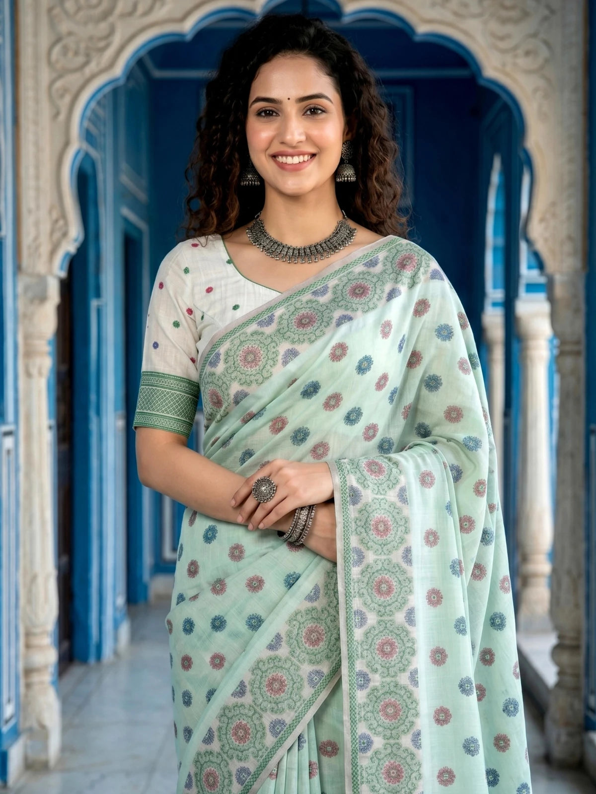 Tarani mint green printed cotton saree upper body view with blouse piece